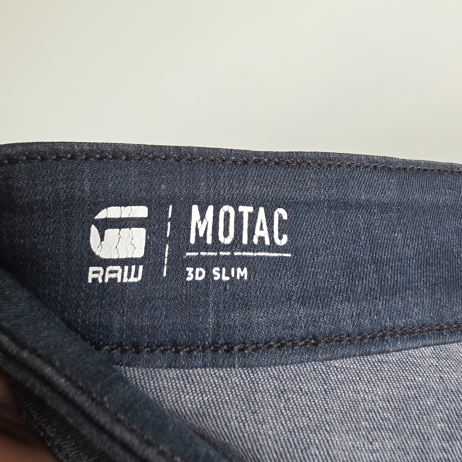 G-Star blue stretch denim slim jeans with biker detailing and logo patch.
