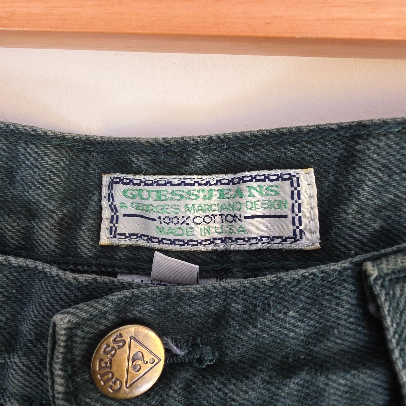 Levi's 501 white jeans distressed with natural wear, made in USA, classic fit.