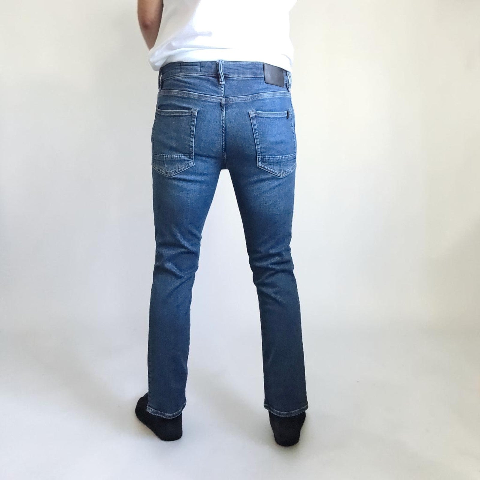 AllSaints blue straight jeans with button fly and stretch cotton-elastane blend.