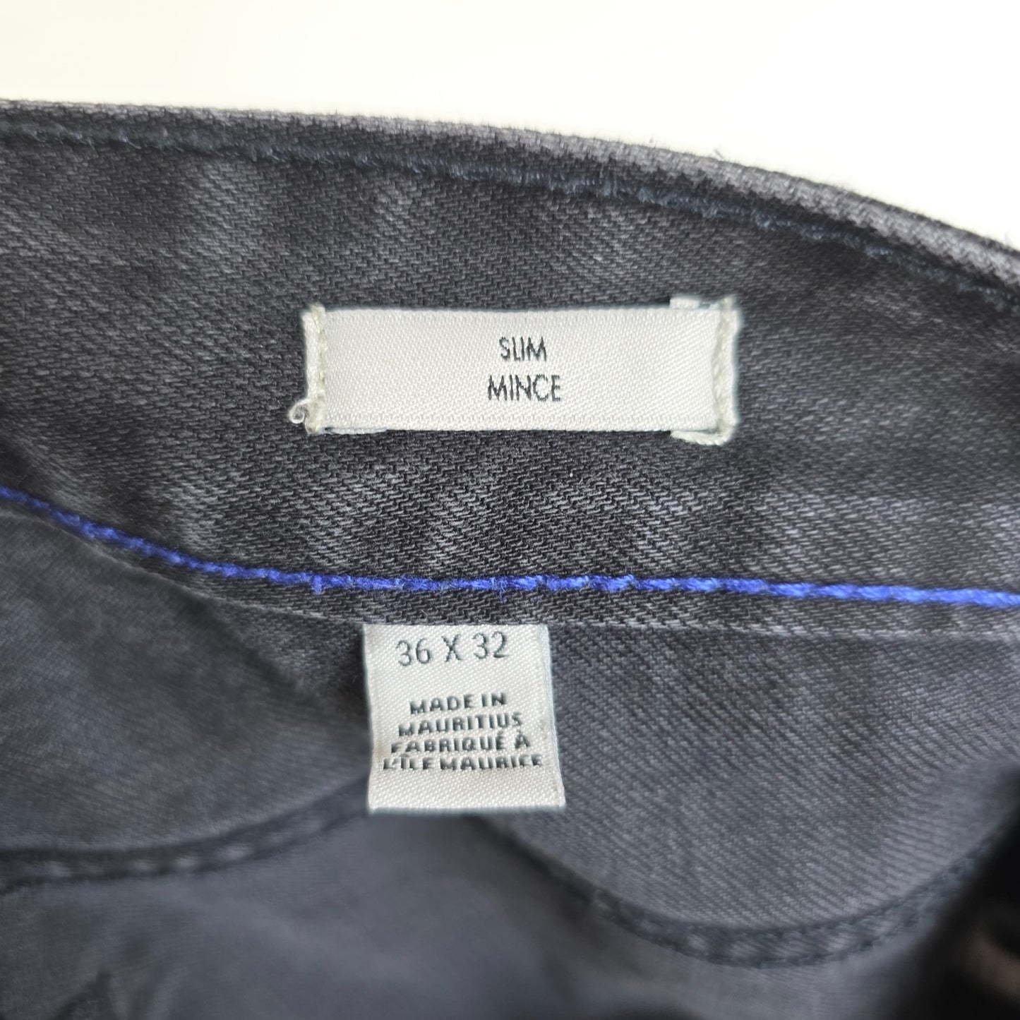 Calvin Klein black straight jeans with logo patch, stretch cotton blend, slim fit design.