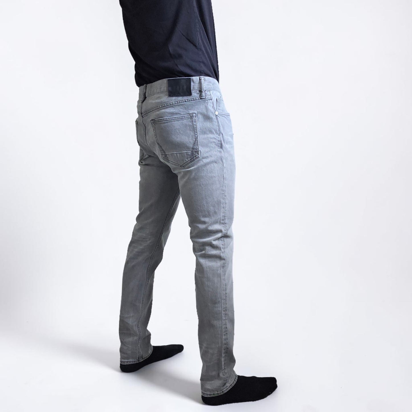AllSaints grey slim jeans with button fly and stretch cotton elastane blend.