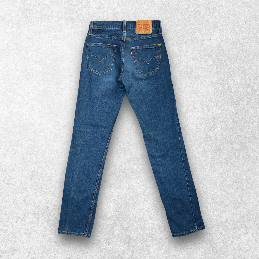 Levi's blue straight jeans with distressed patches and natural wear, made in USA.