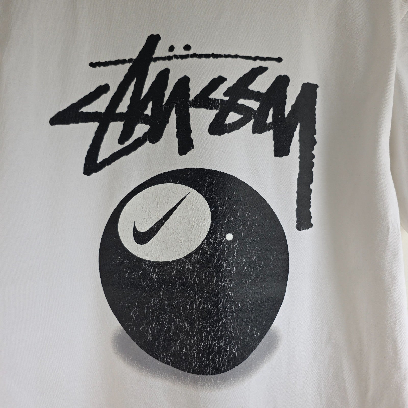 Stüssy x Nike white t-shirt with large 8 Ball back print and cotton material.