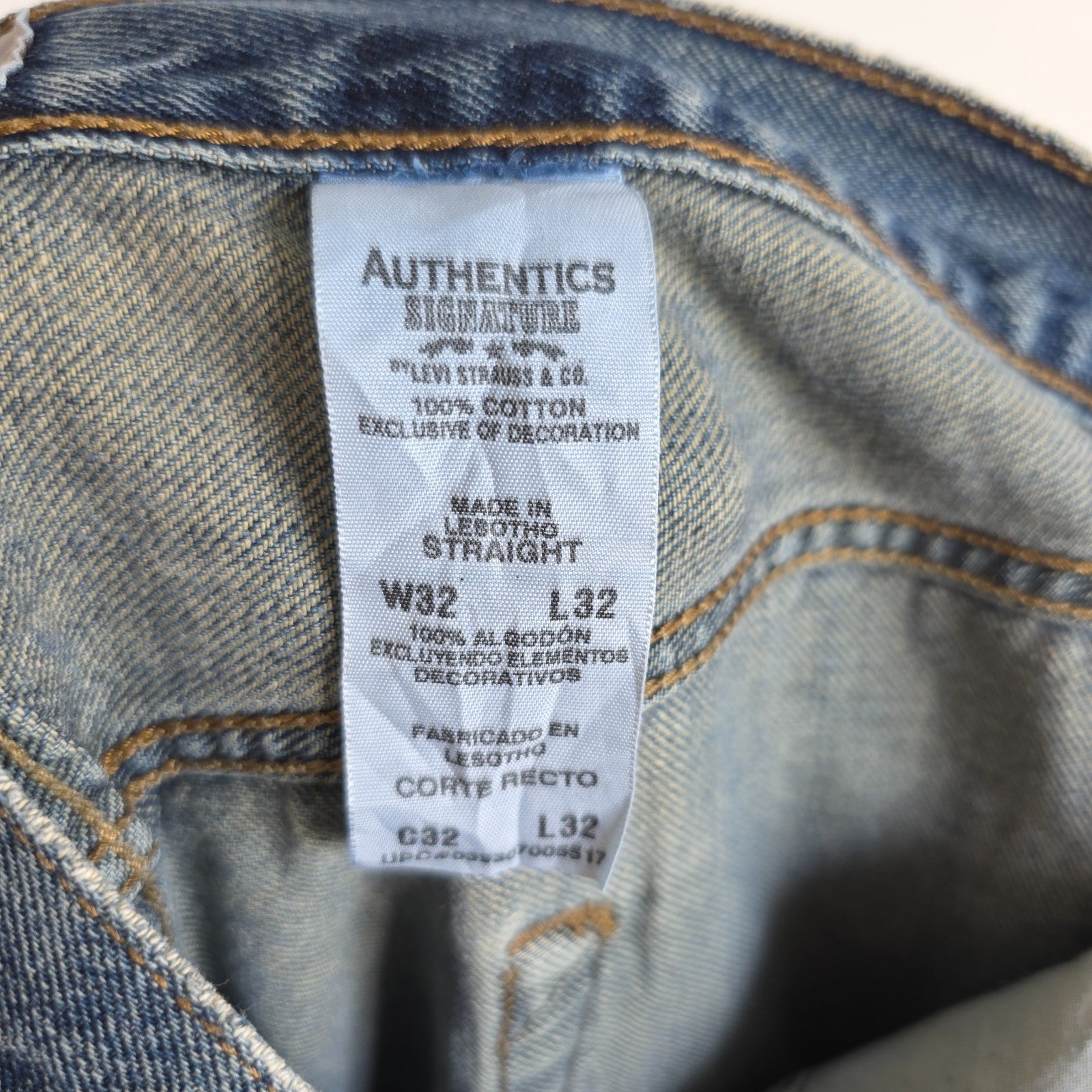 Levi's blue straight leg jeans, cotton material, missing back waist patch, casual style.