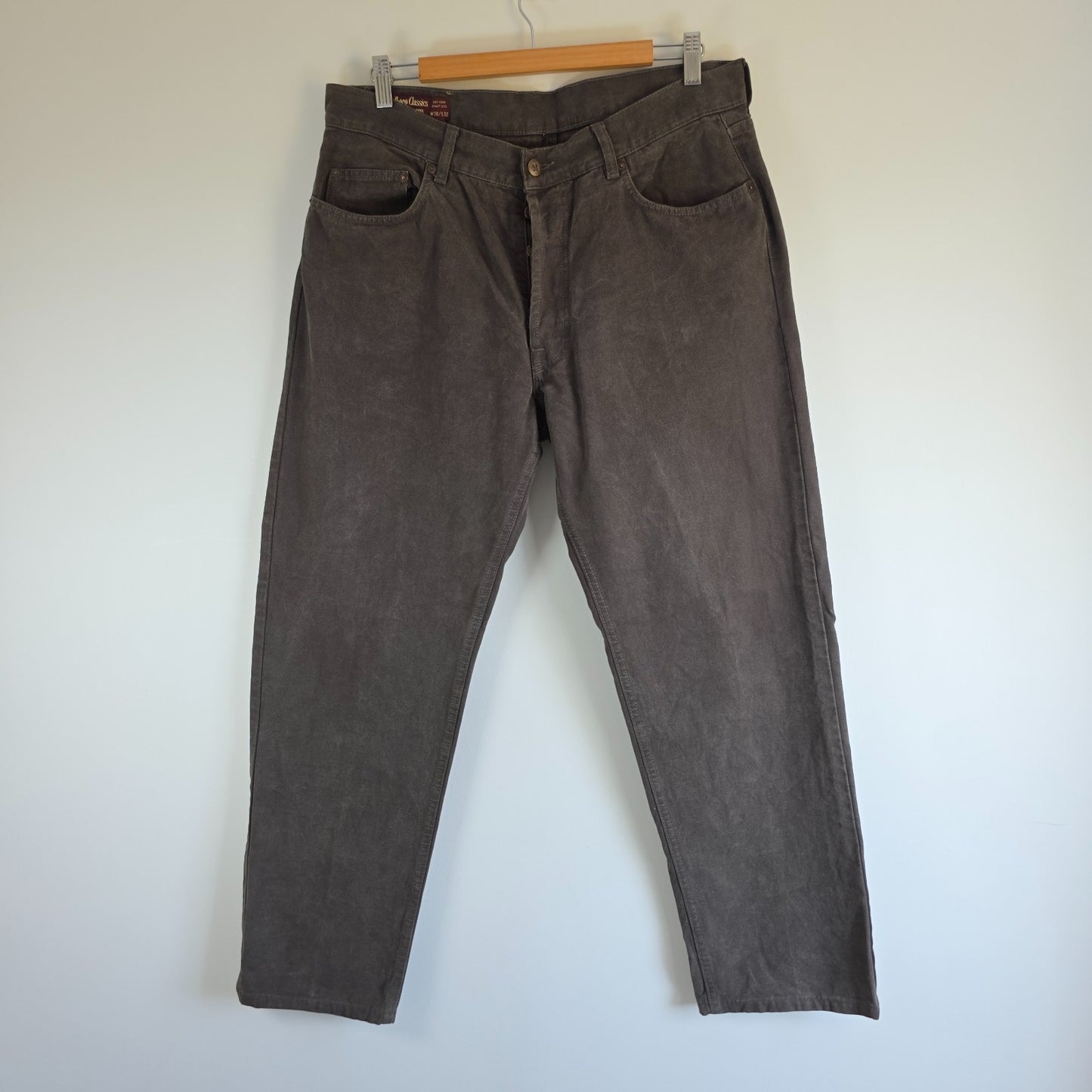Marlboro Classics grey straight jeans with button fly and vintage logo detail.