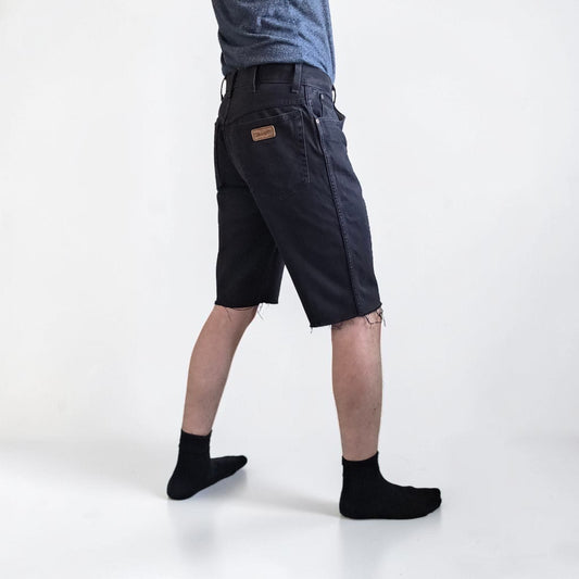 Wrangler black denim shorts W33 with frayed hems and copper-toned button.
