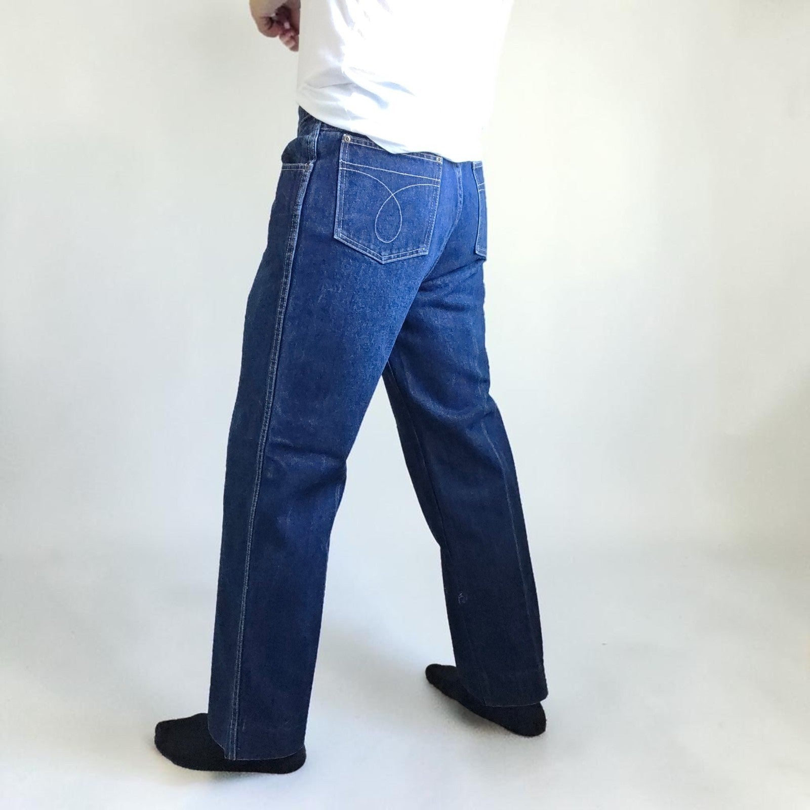 Calvin Klein blue straight leg jeans with vintage 90s style and cotton material.