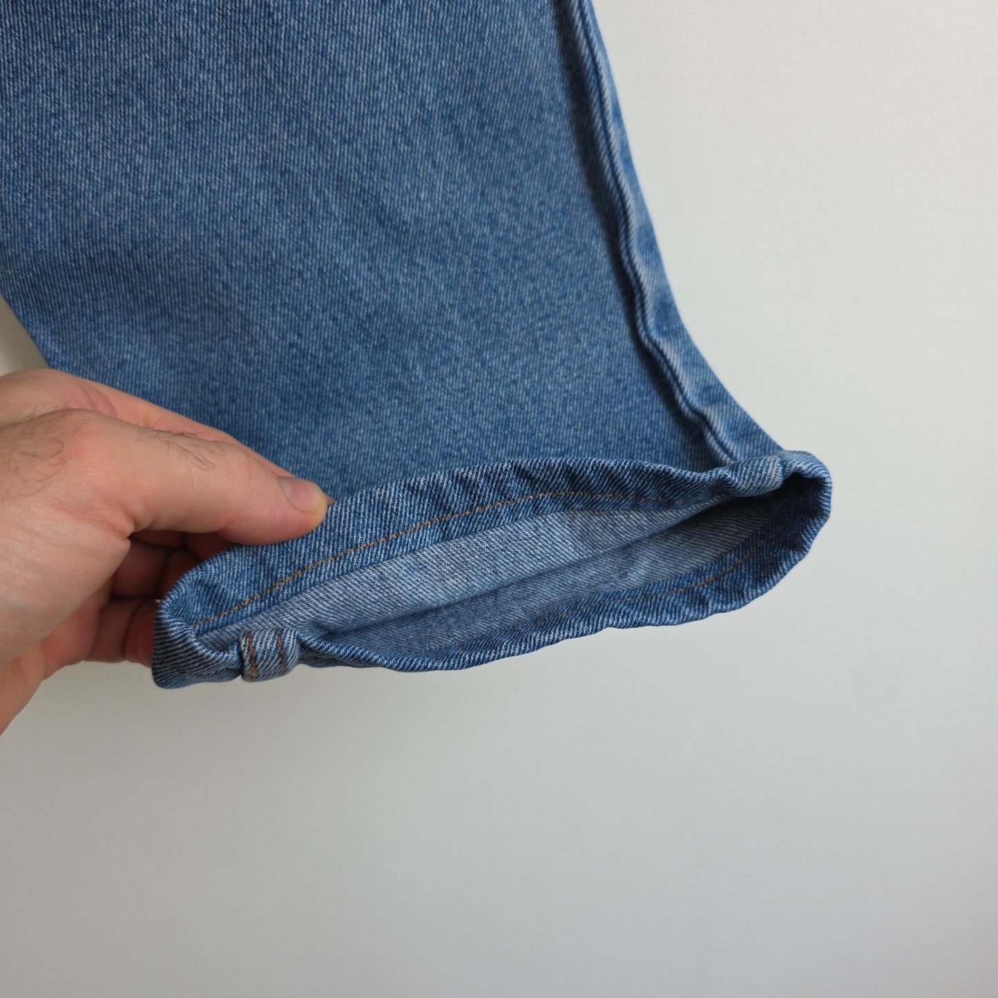 Robe Di Kappa blue straight jeans with vintage wash and subtle logo detail.