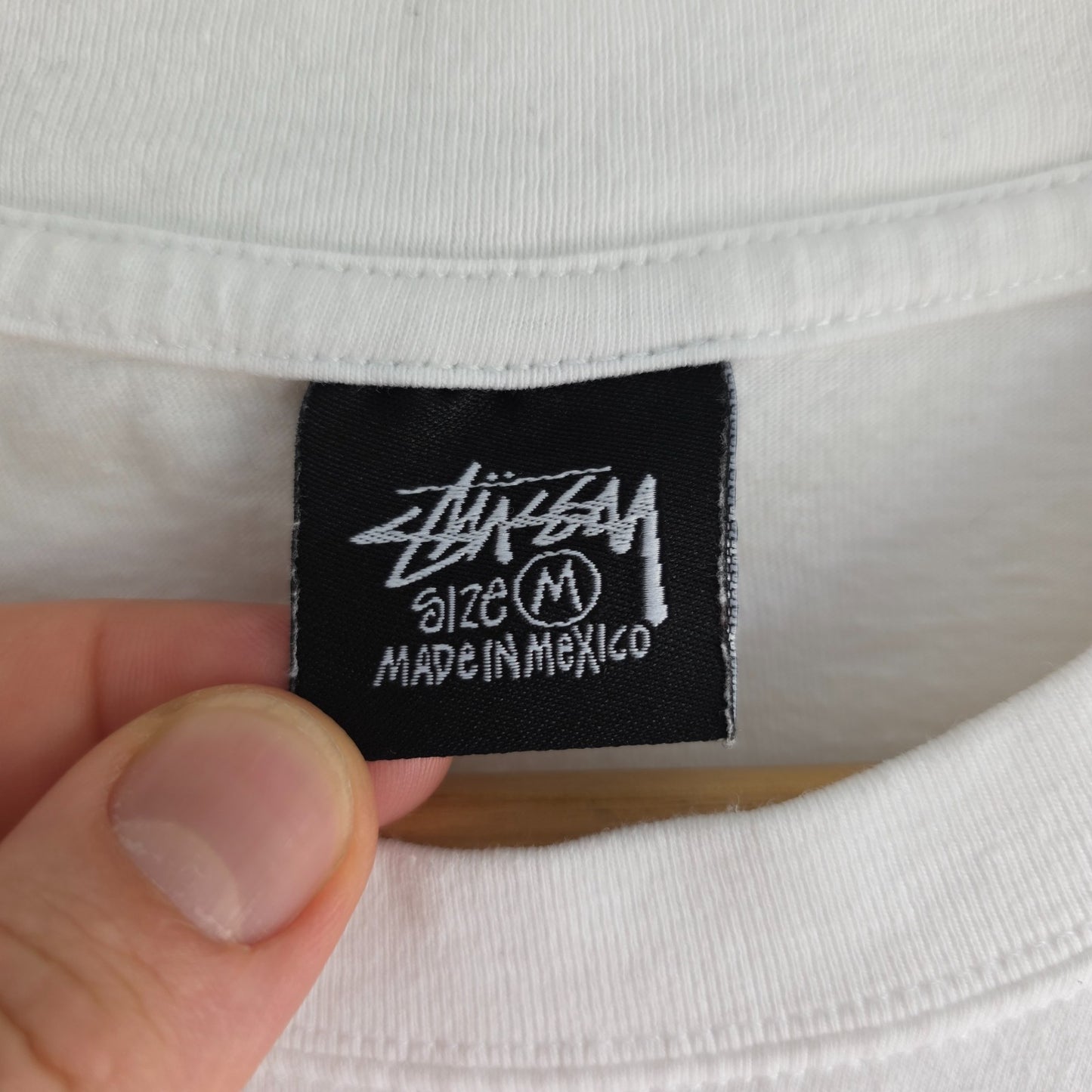 Stüssy x Nike white t-shirt with large 8 Ball back print and cotton material.
