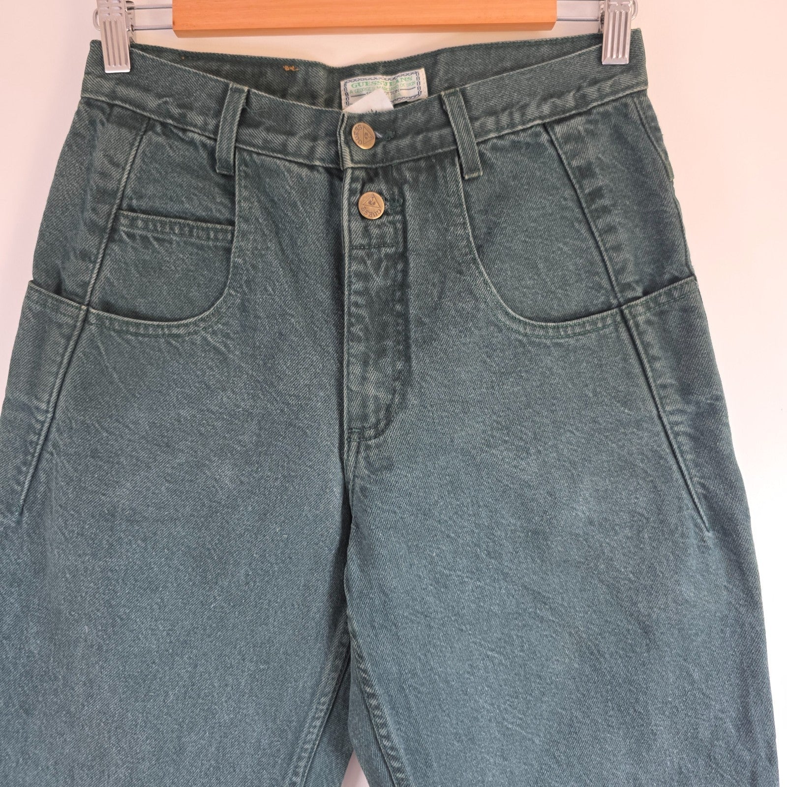 Levi's 501 white jeans distressed with natural wear, made in USA, classic fit.
