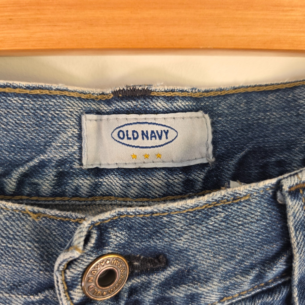 Old Navy blue carpenter jeans with hammer loop and utility pocket detailing.