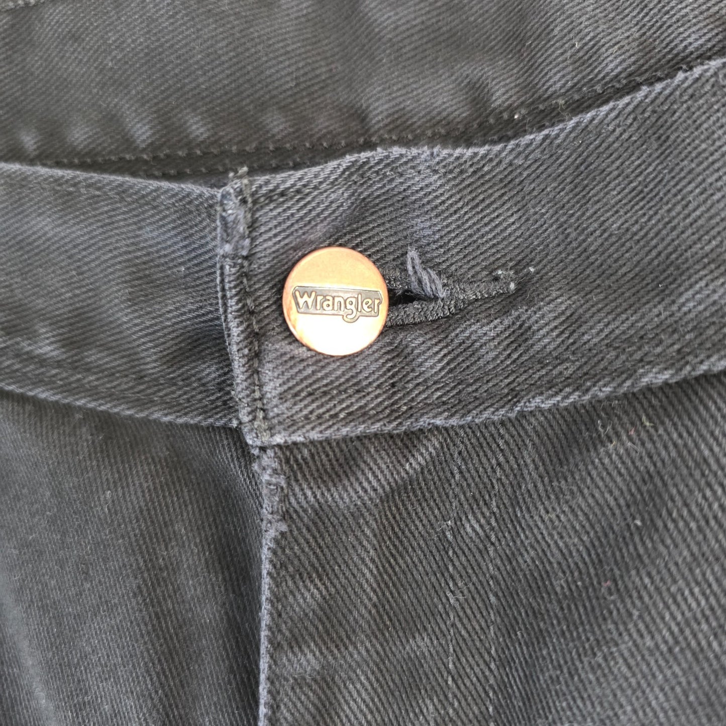 Wrangler black denim shorts W33 with frayed hems and copper-toned button.