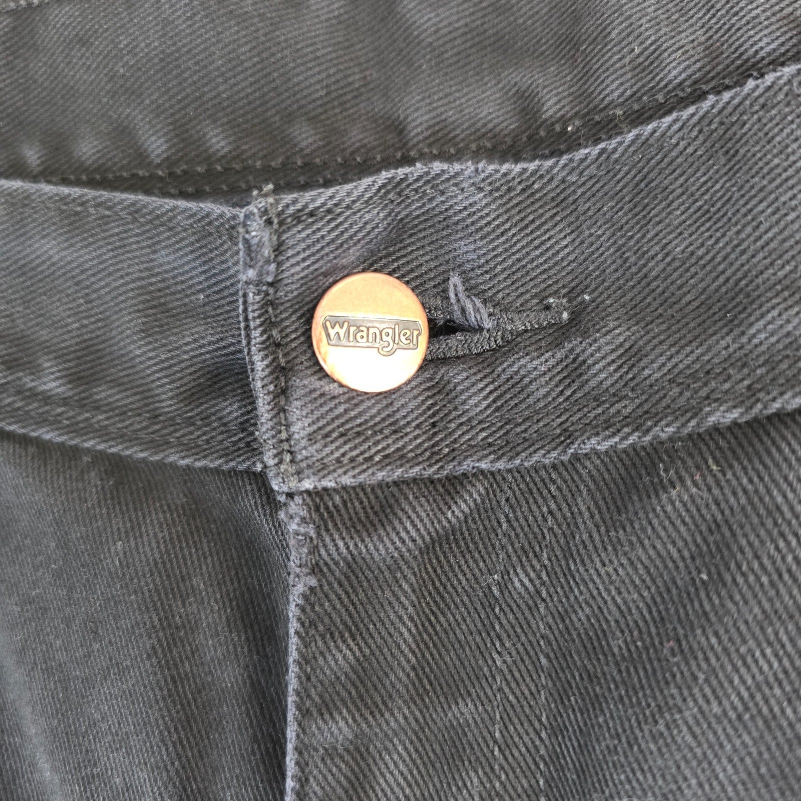 Wrangler black denim shorts W33 with frayed hems and copper-toned button.