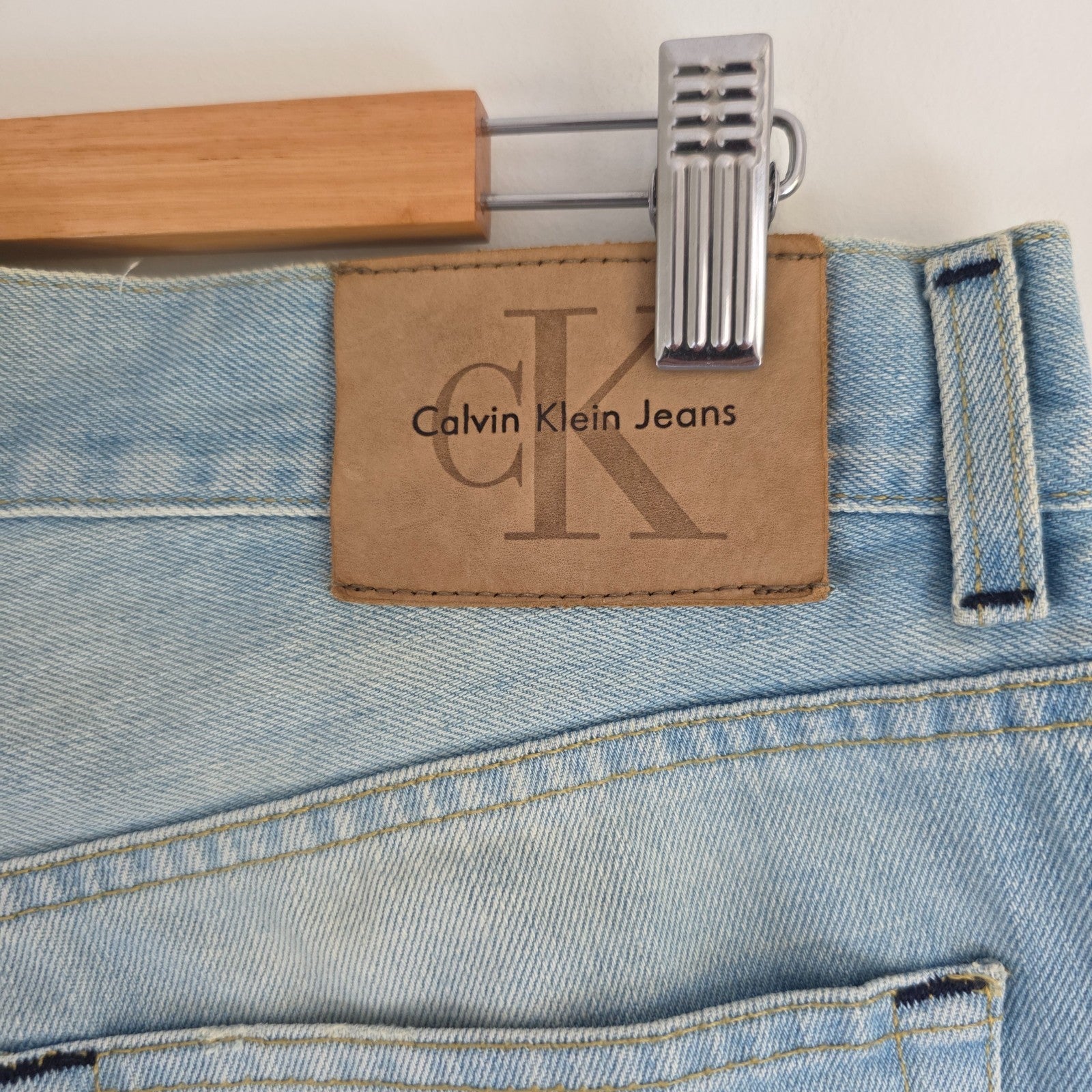 Calvin Klein light blue straight jeans, 100% cotton, classic five-pocket design.