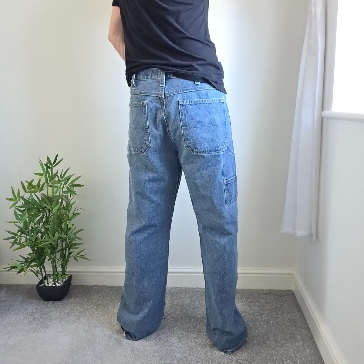 Faded Glory blue carpenter jeans with hammer loop and utility pockets, 100% cotton.