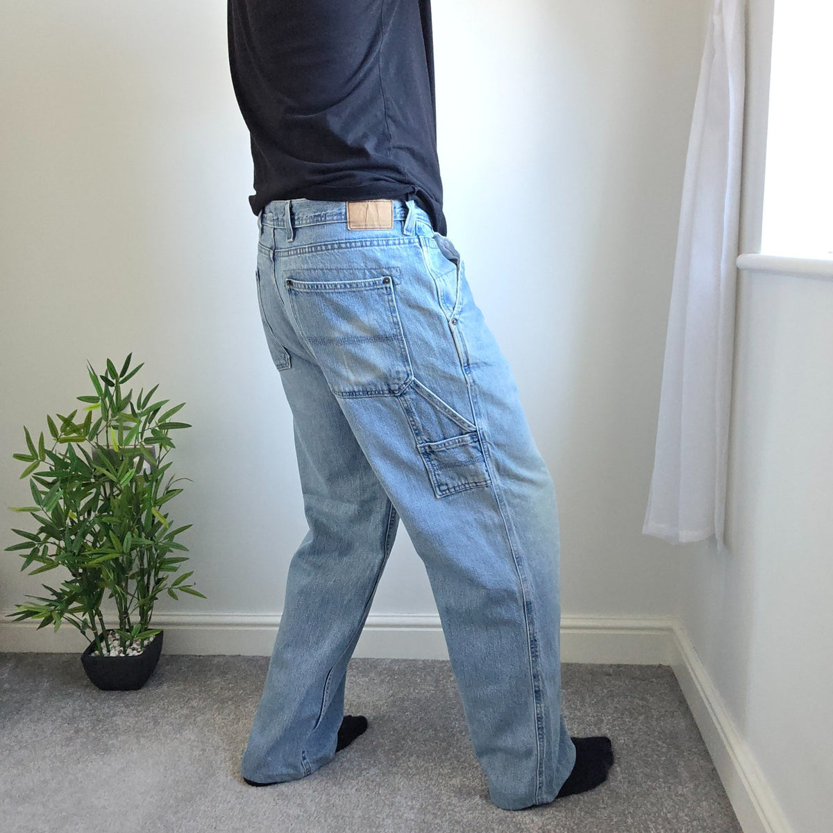 Urban Up blue carpenter jeans with hammer loop and utility pocket detailing.