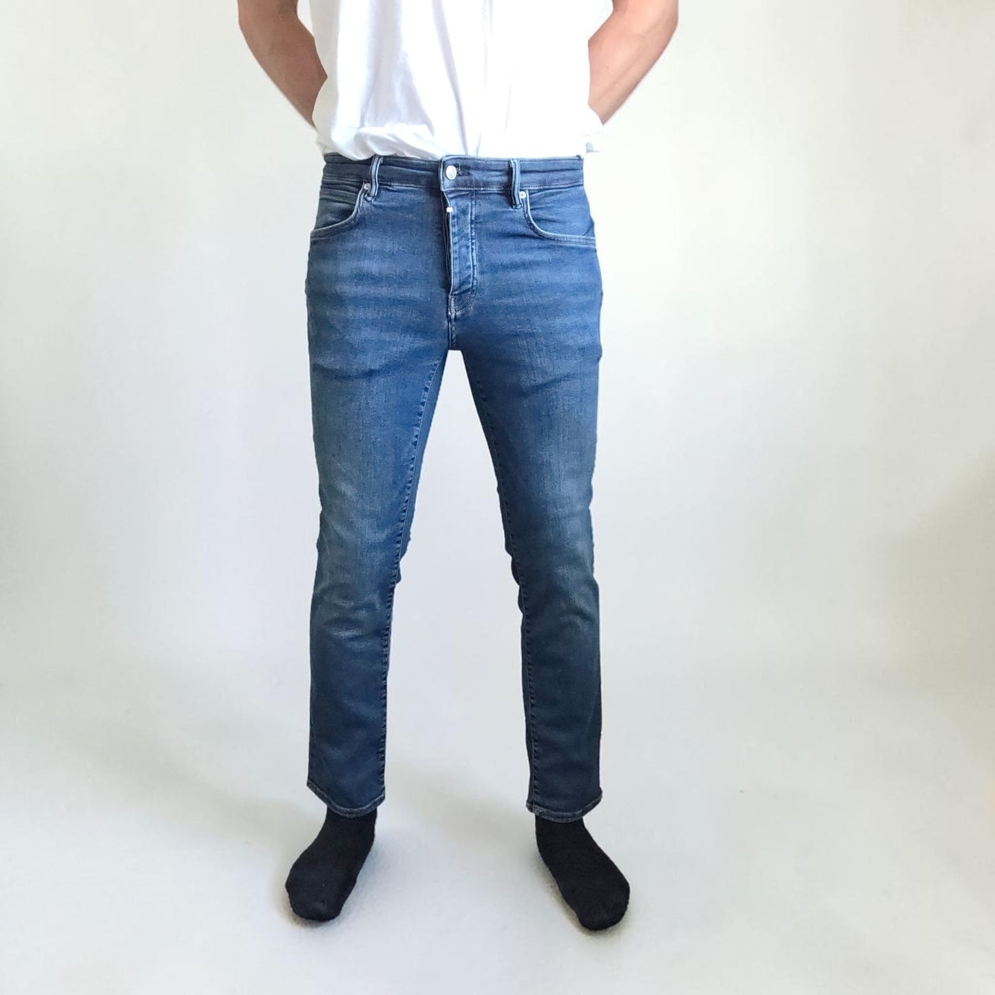 AllSaints blue straight jeans with button fly and stretch cotton-elastane blend.