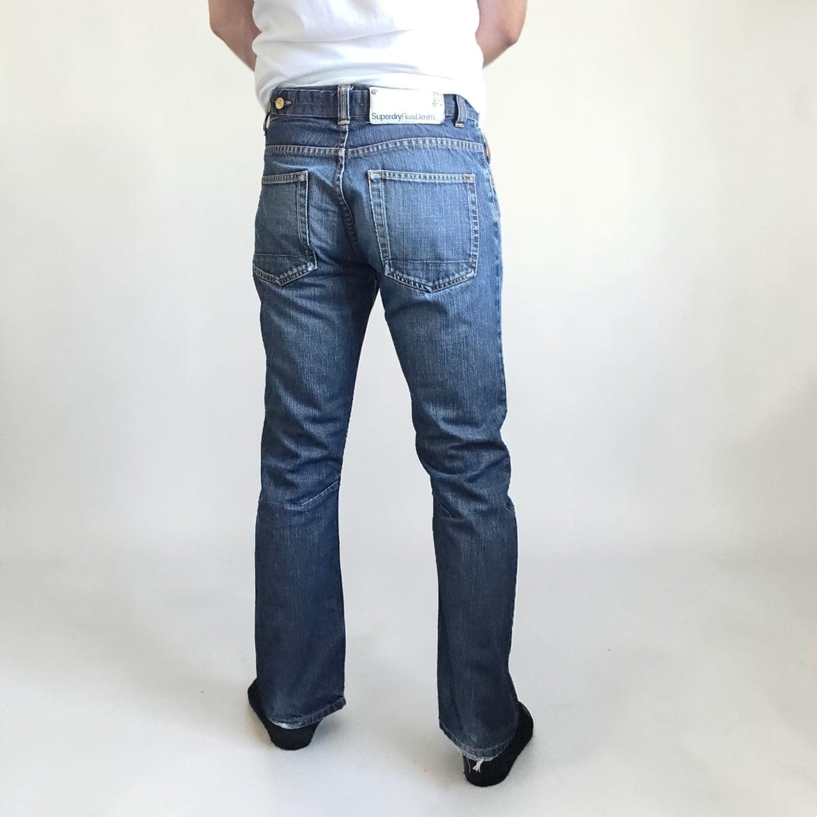 Superdry blue straight jeans with button fly, vintage raw denim, light wear.