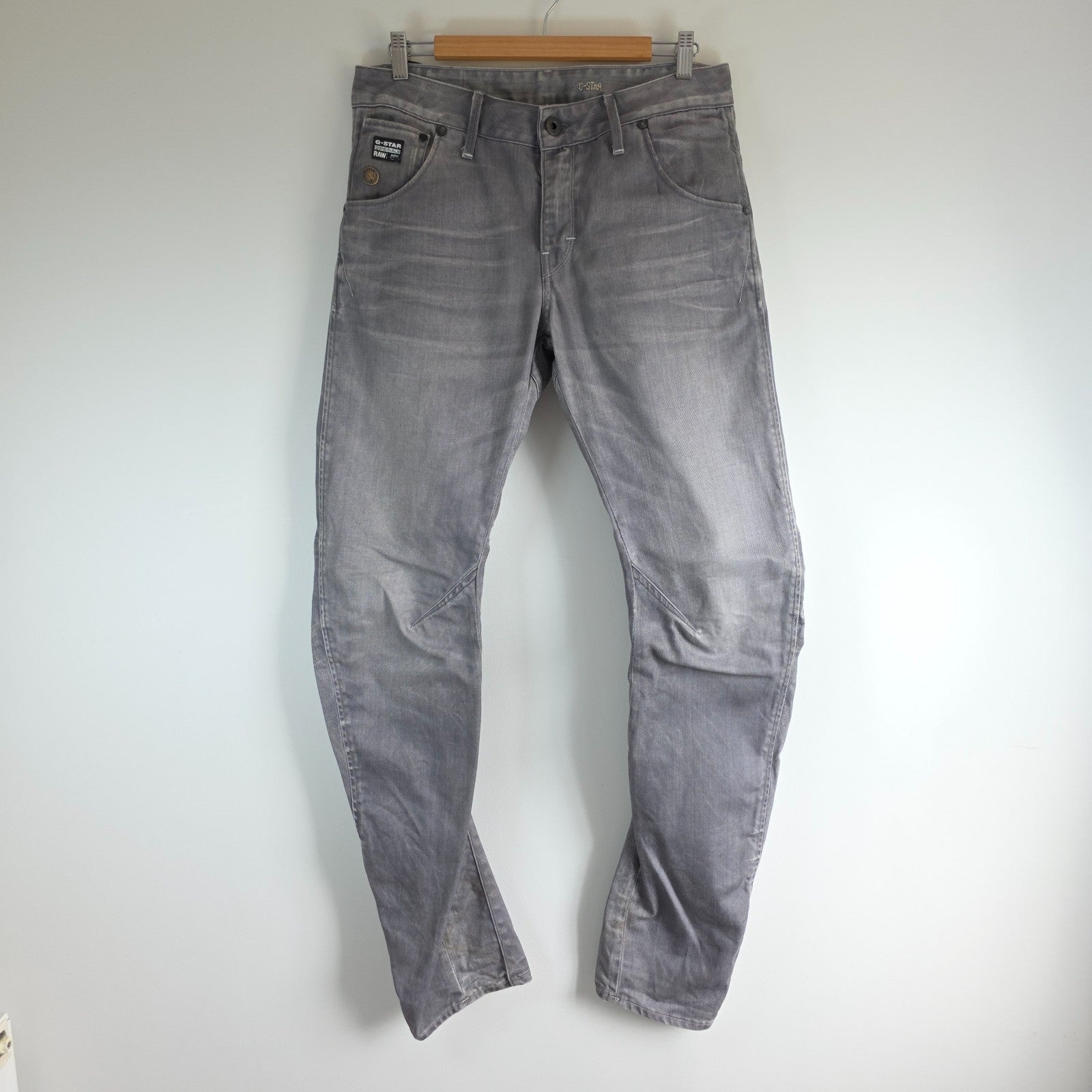 G-Star grey straight jeans with biker style detailing and subtle wear at the hem.