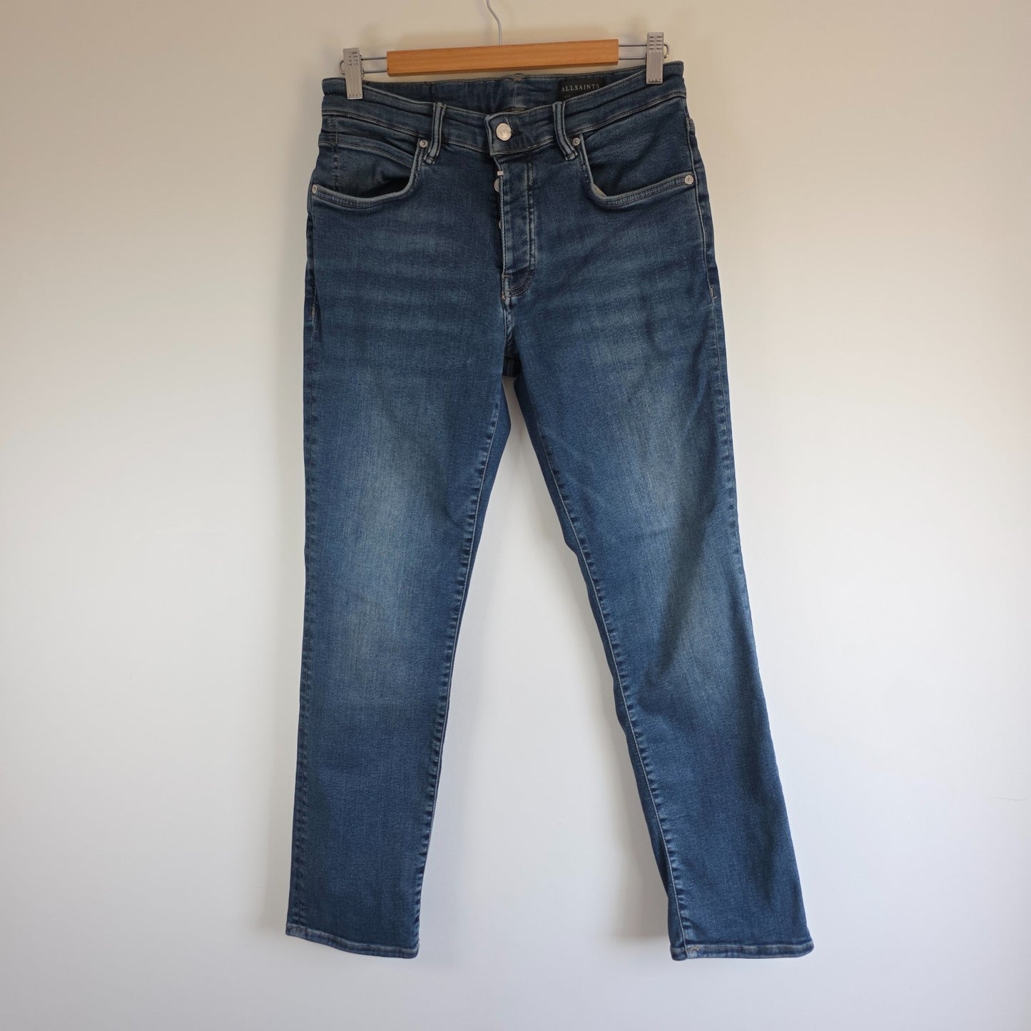 AllSaints blue straight jeans with button fly and stretch cotton-elastane blend.