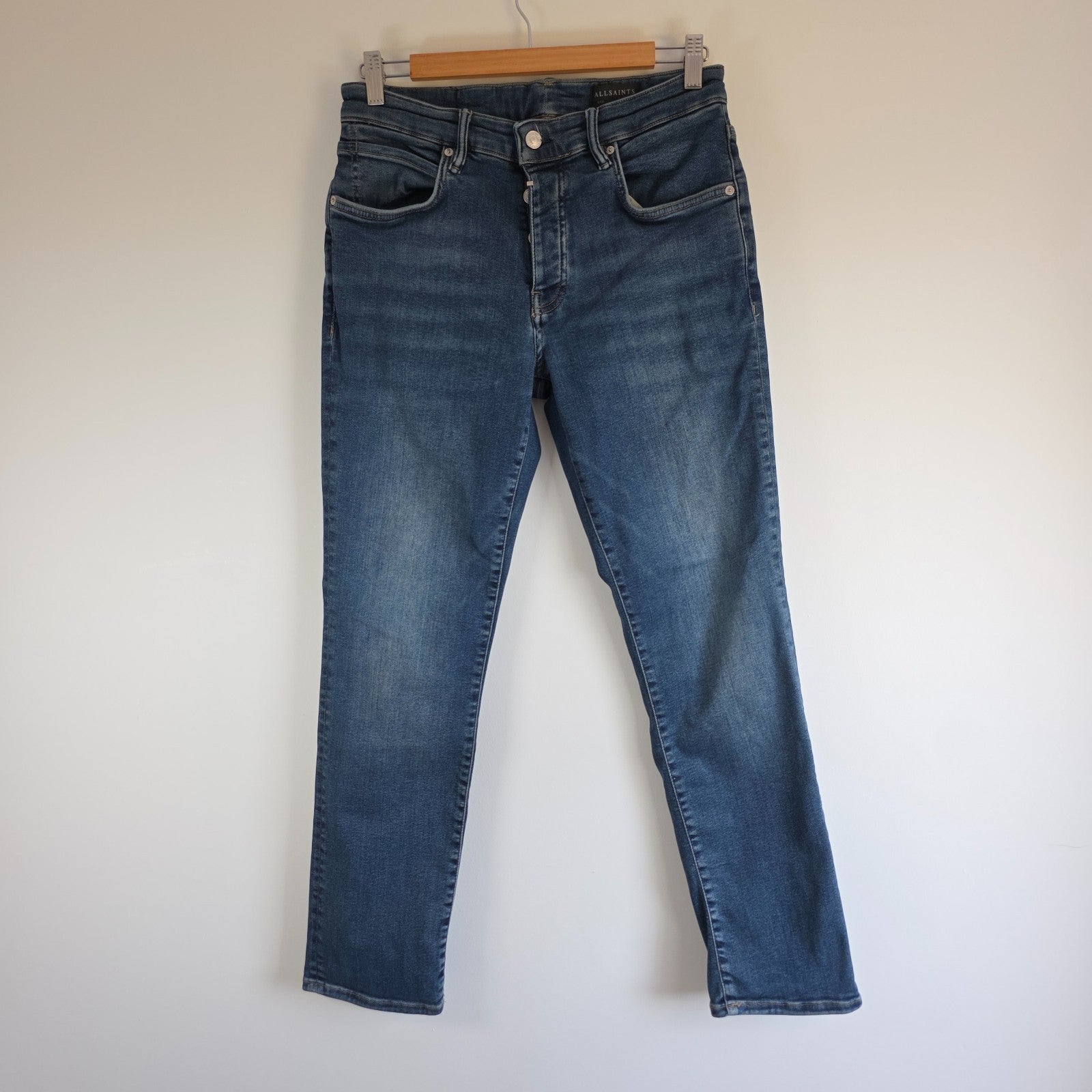 AllSaints blue straight jeans with button fly and stretch cotton-elastane blend.
