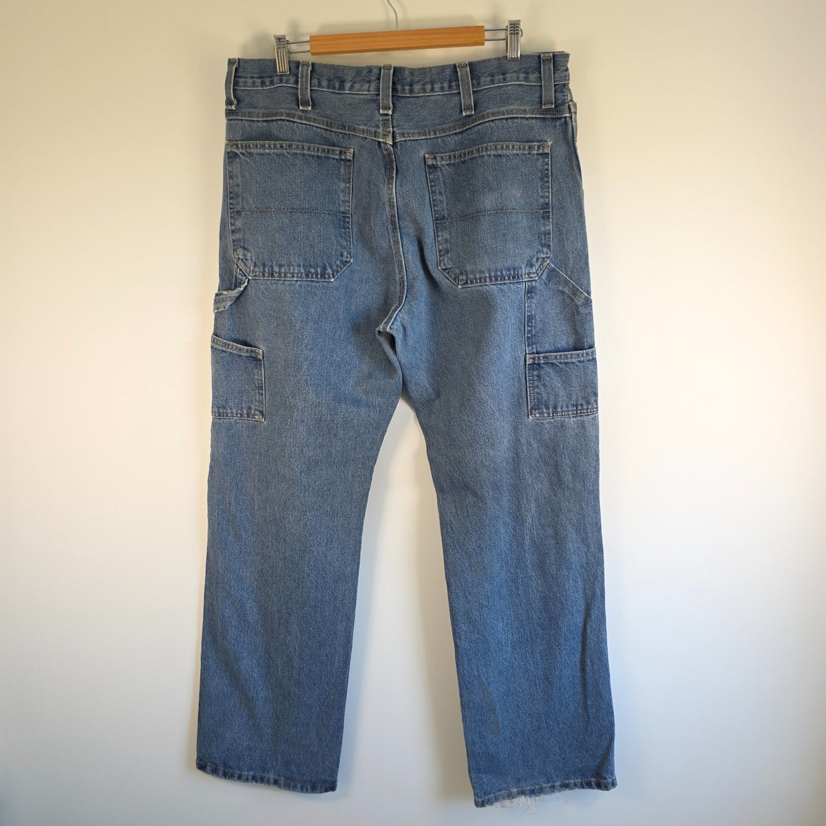 Faded Glory blue carpenter jeans with hammer loop and utility pockets, 100% cotton.