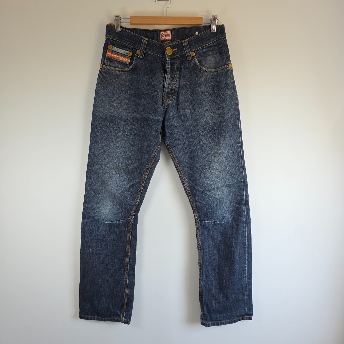 Superdry blue straight jeans with button fly, vintage raw denim, light wear.