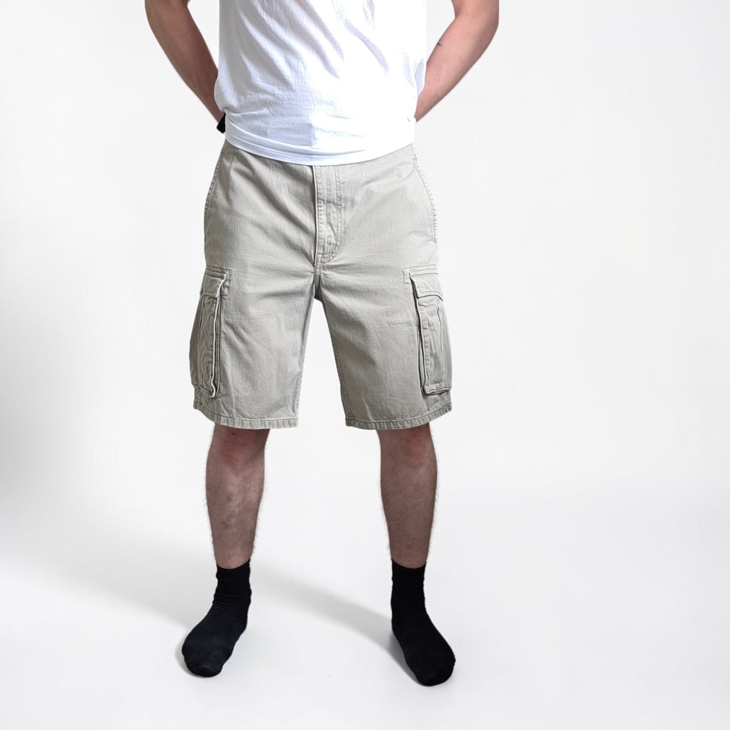 Levi's beige cargo shorts with utility pockets and cotton material, very good condition.