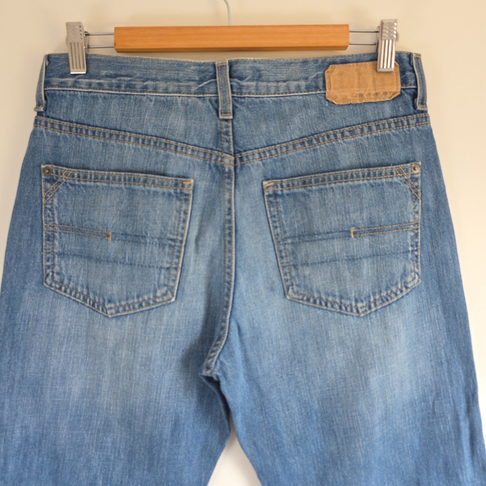 Calvin Klein blue straight jeans 100% cotton with relaxed fit and subtle logo detail.