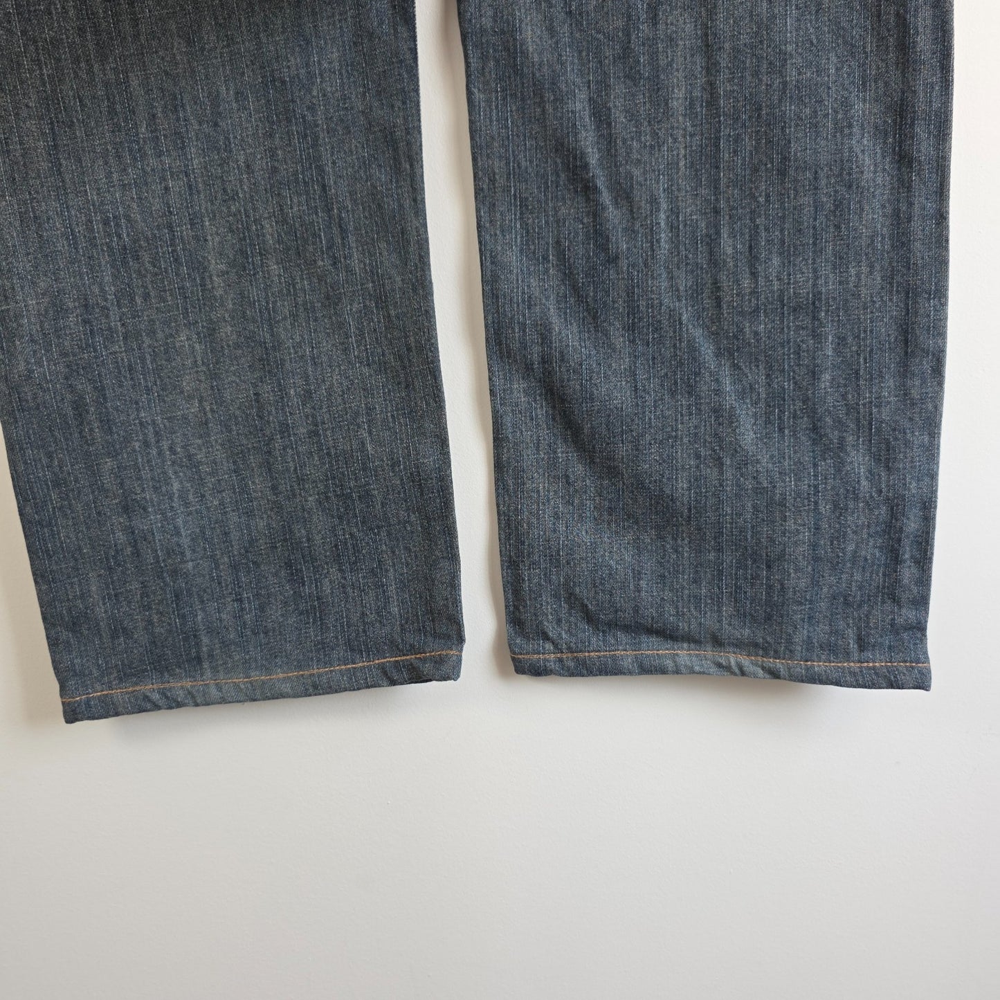 Wrangler blue straight jeans with relaxed fit, 100% cotton, professional hemmed to 30 inches.