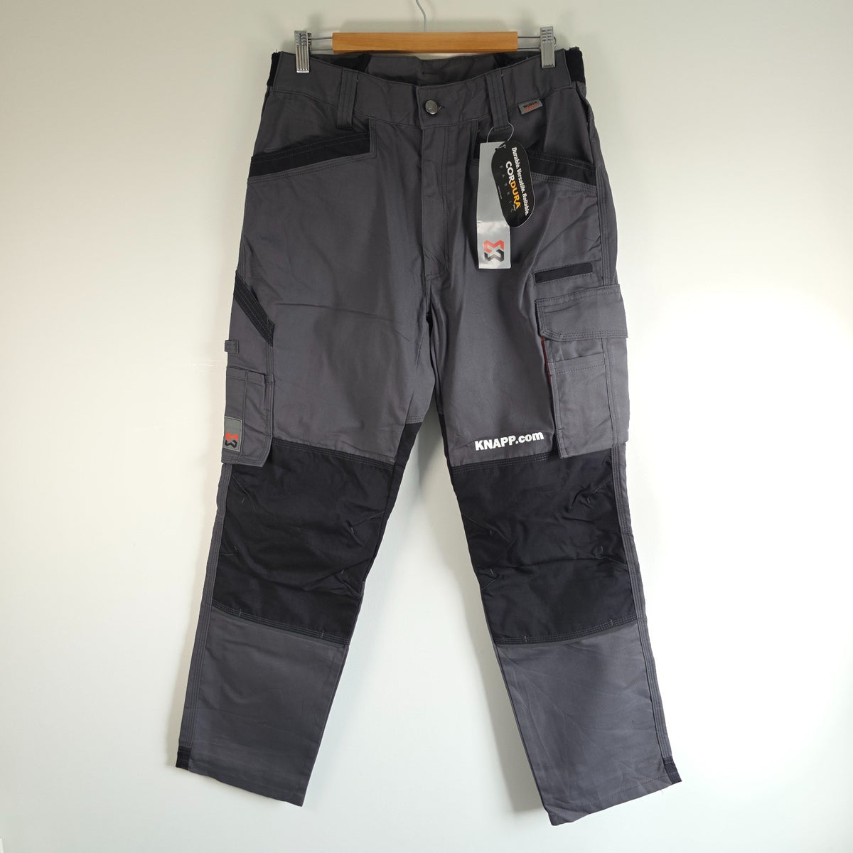 Würth Modyf black cargo trousers with reinforced knees and multiple utility pockets.