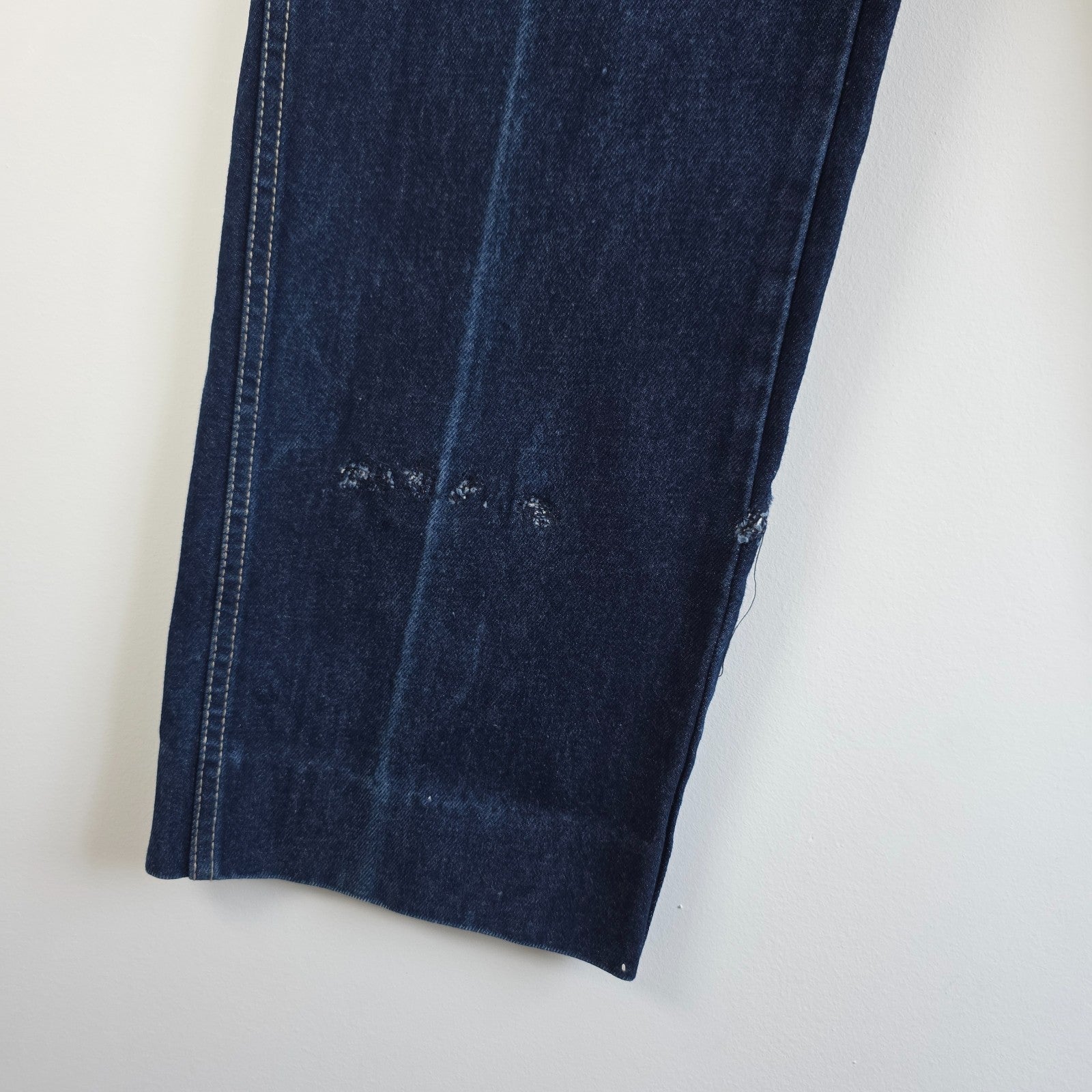 Calvin Klein blue straight leg jeans with vintage 90s style and cotton material.