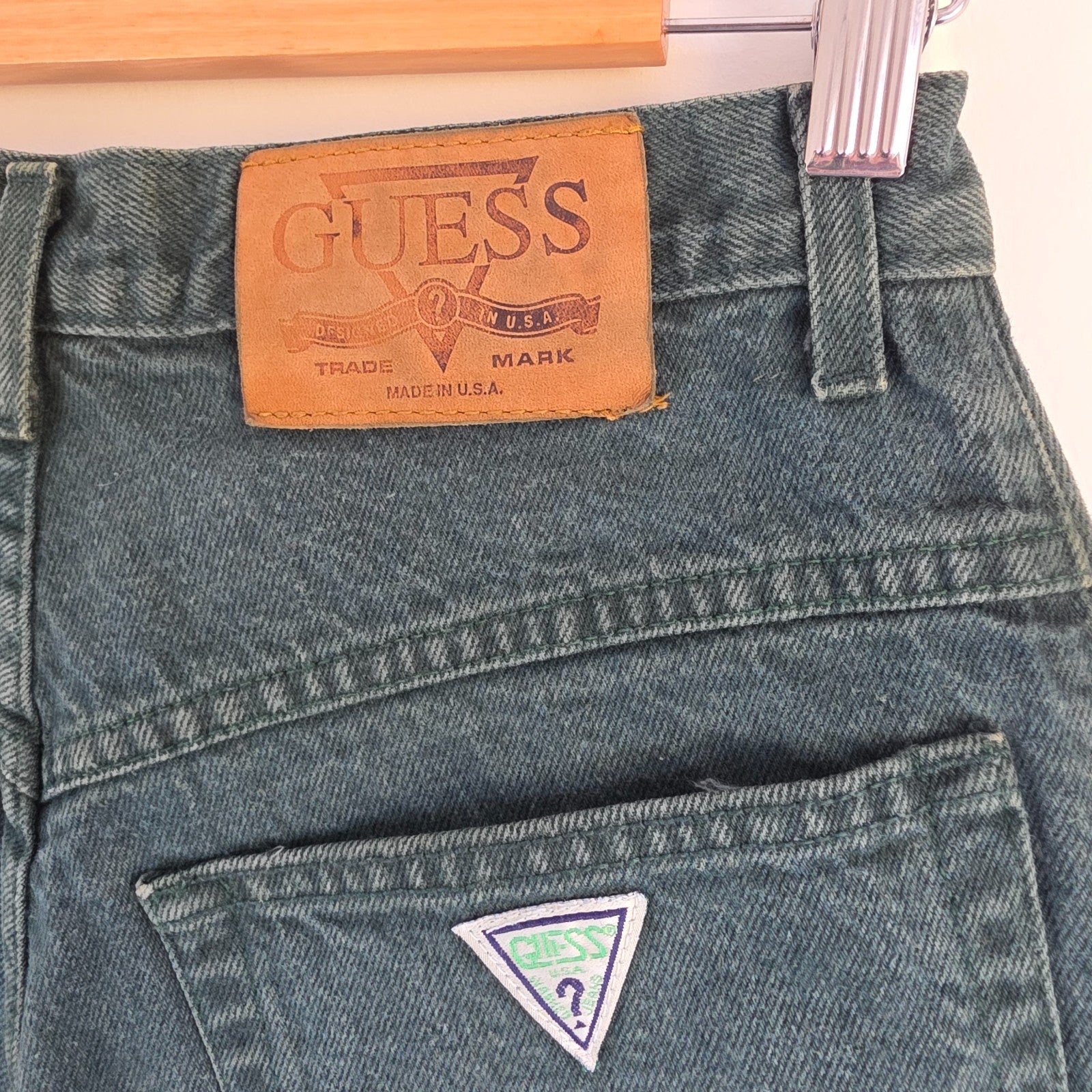 Levi's 501 white jeans distressed with natural wear, made in USA, classic fit.