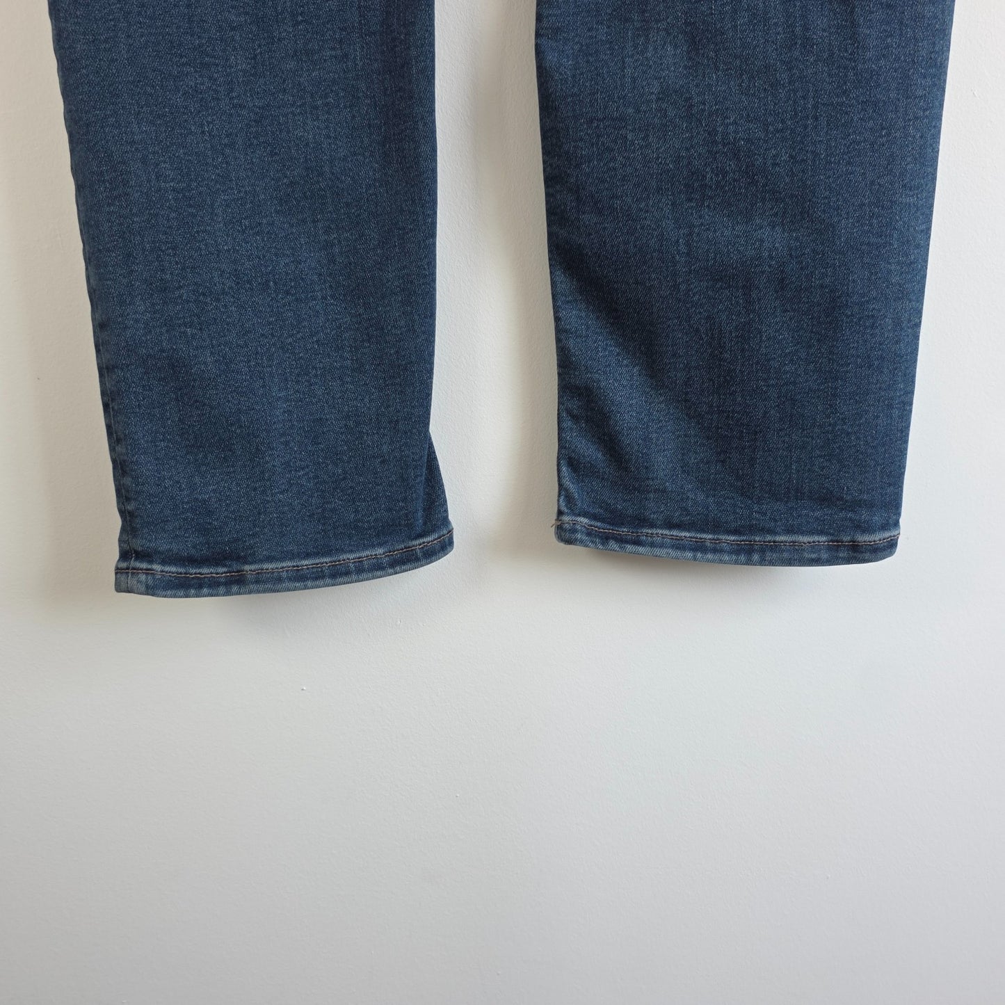 AllSaints blue straight jeans with button fly and stretch cotton-elastane blend.