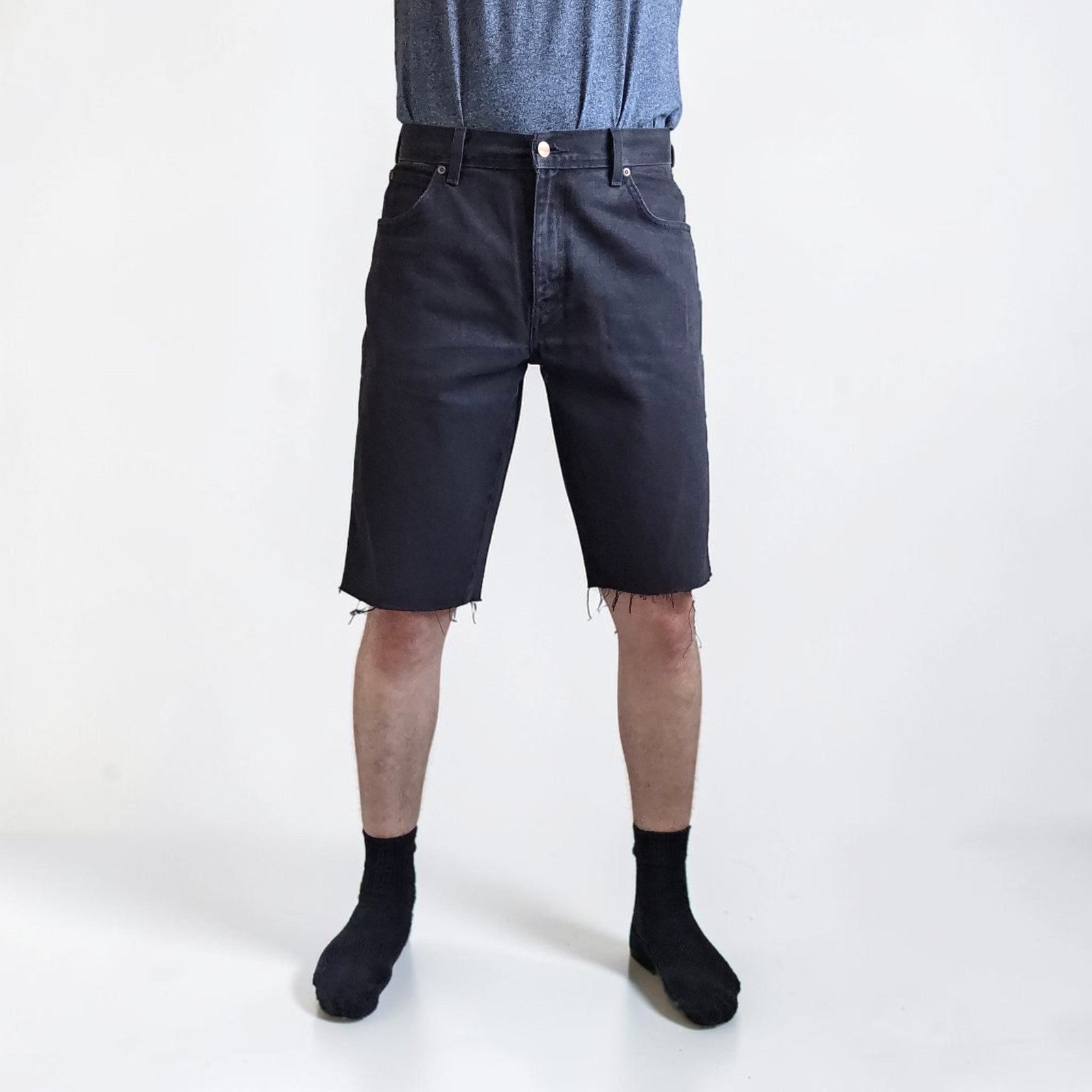 Wrangler black denim shorts W33 with frayed hems and copper-toned button.