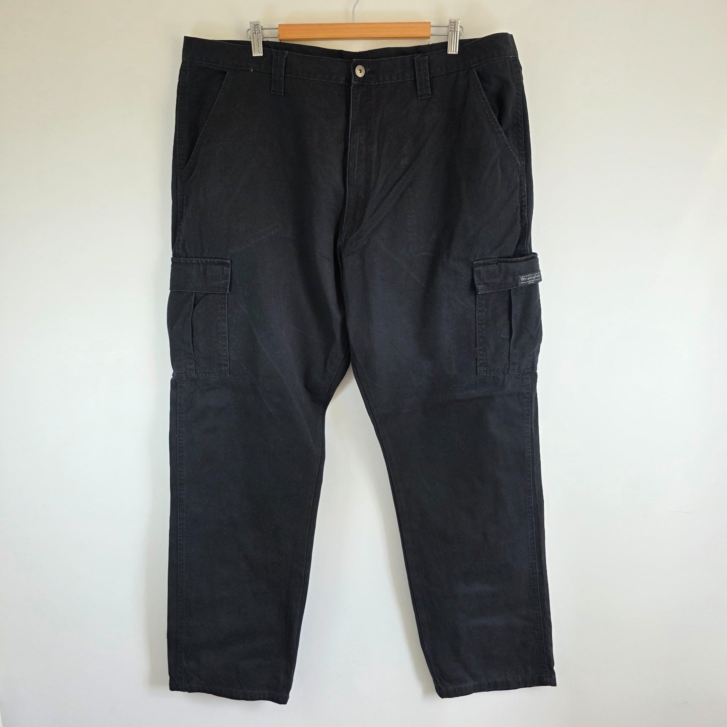 Wrangler black cargo trousers relaxed fit with utility pockets and durable cotton material.