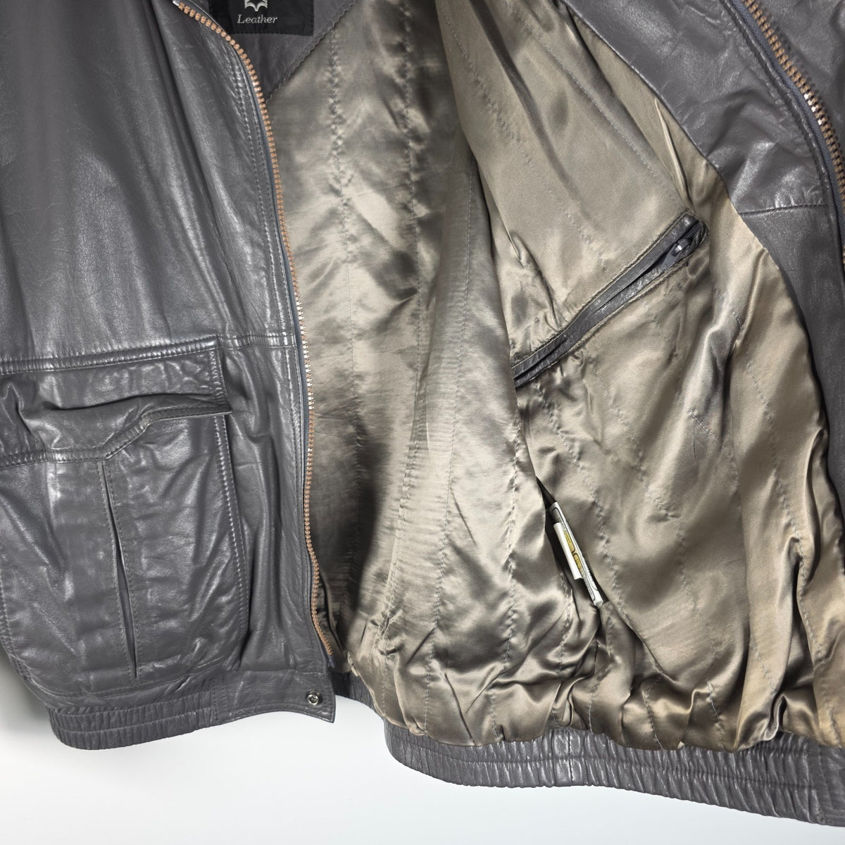 St Michael grey leather bomber jacket with utility pockets and elasticated waistband.