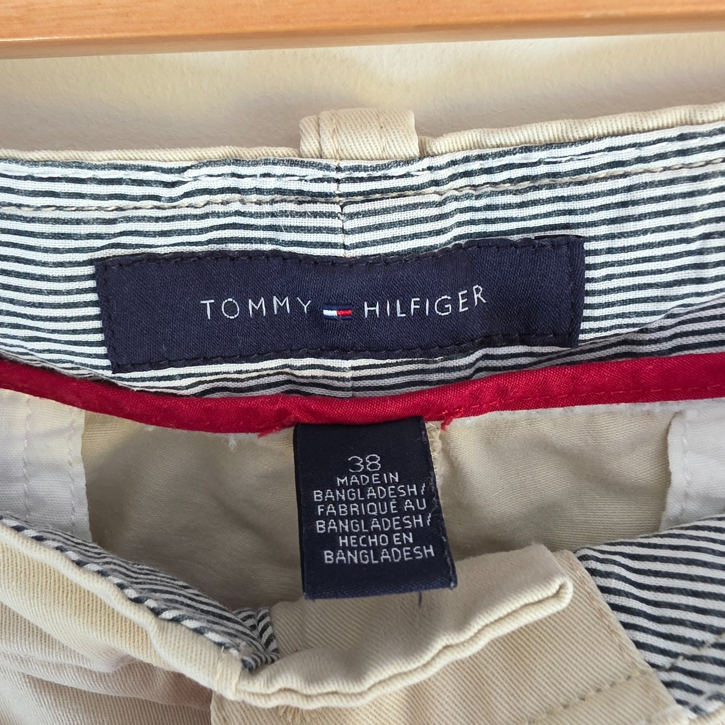 Tommy Hilfiger beige cargo shorts with utility pockets and cotton material.