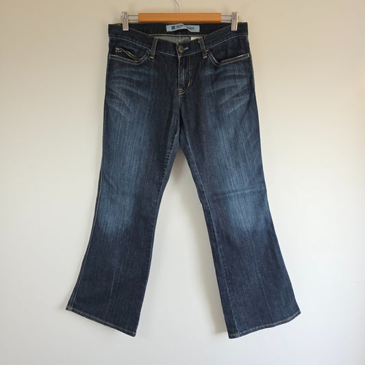 Gap blue straight jeans with low rise, bootcut style, made of stretch denim.