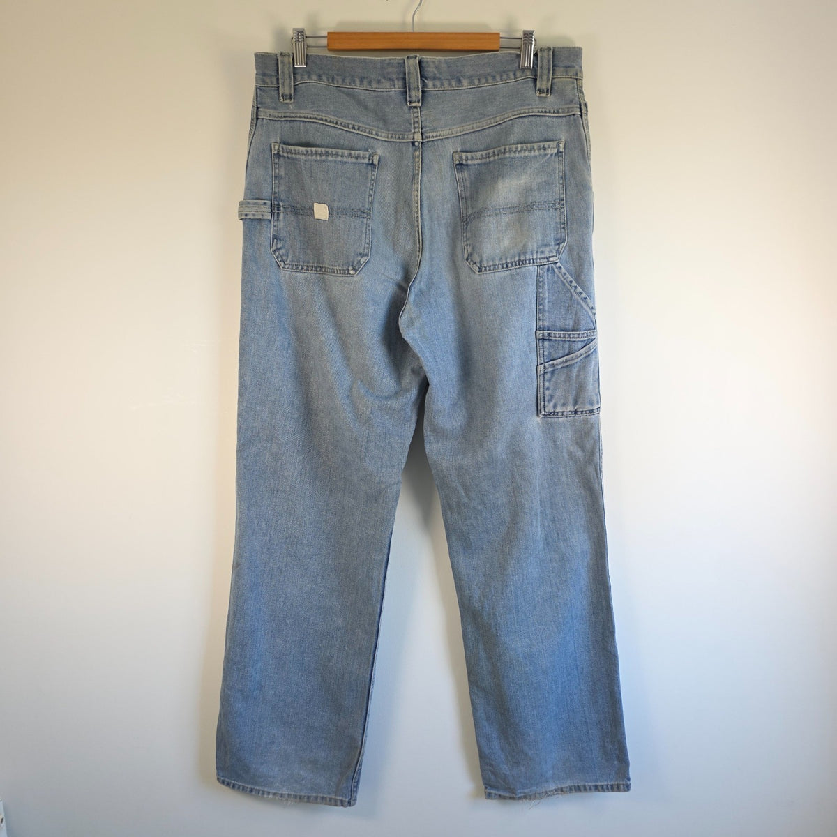 Old Navy blue carpenter jeans with hammer loop and utility pockets, 100% cotton.