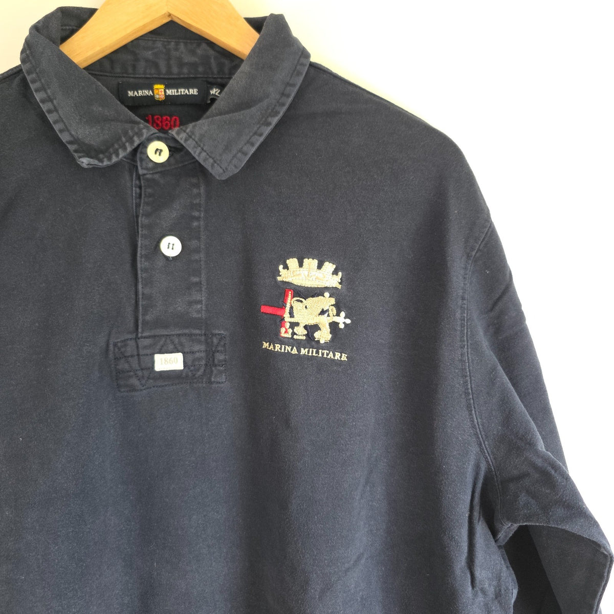 Marina Militare blue rugby shirt with embroidered crest and large nautical anchor appliqué.