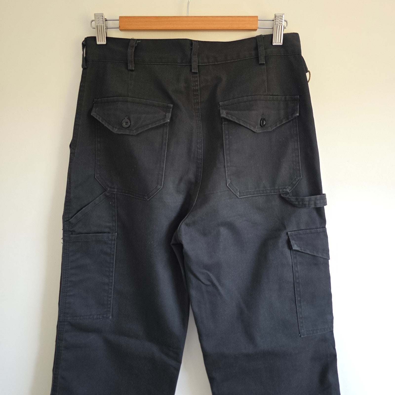 Dickies black cargo trousers with double knee panels and hammer loop detail.