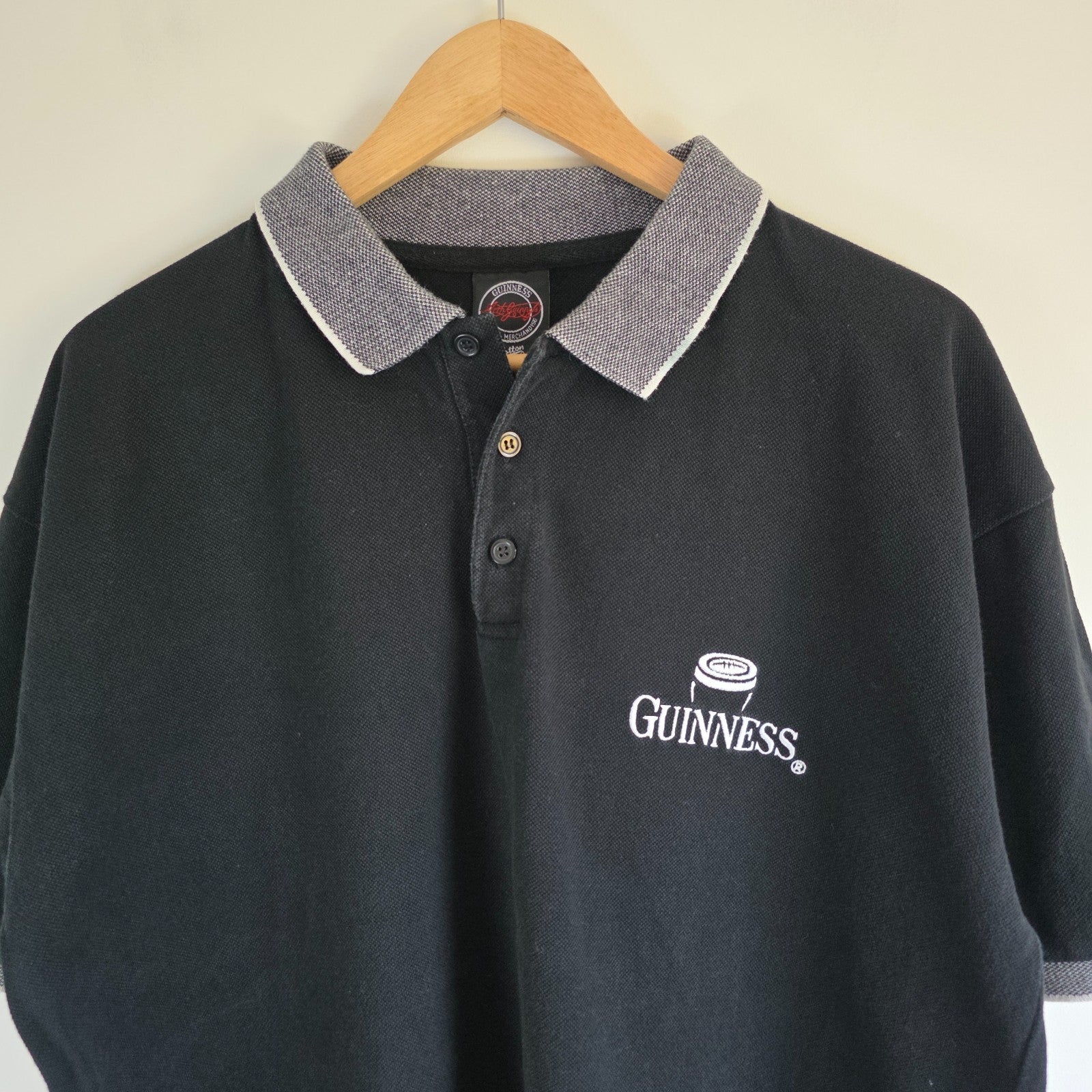 Guinness black polo shirt embroidered logo, 100% cotton, vintage style.