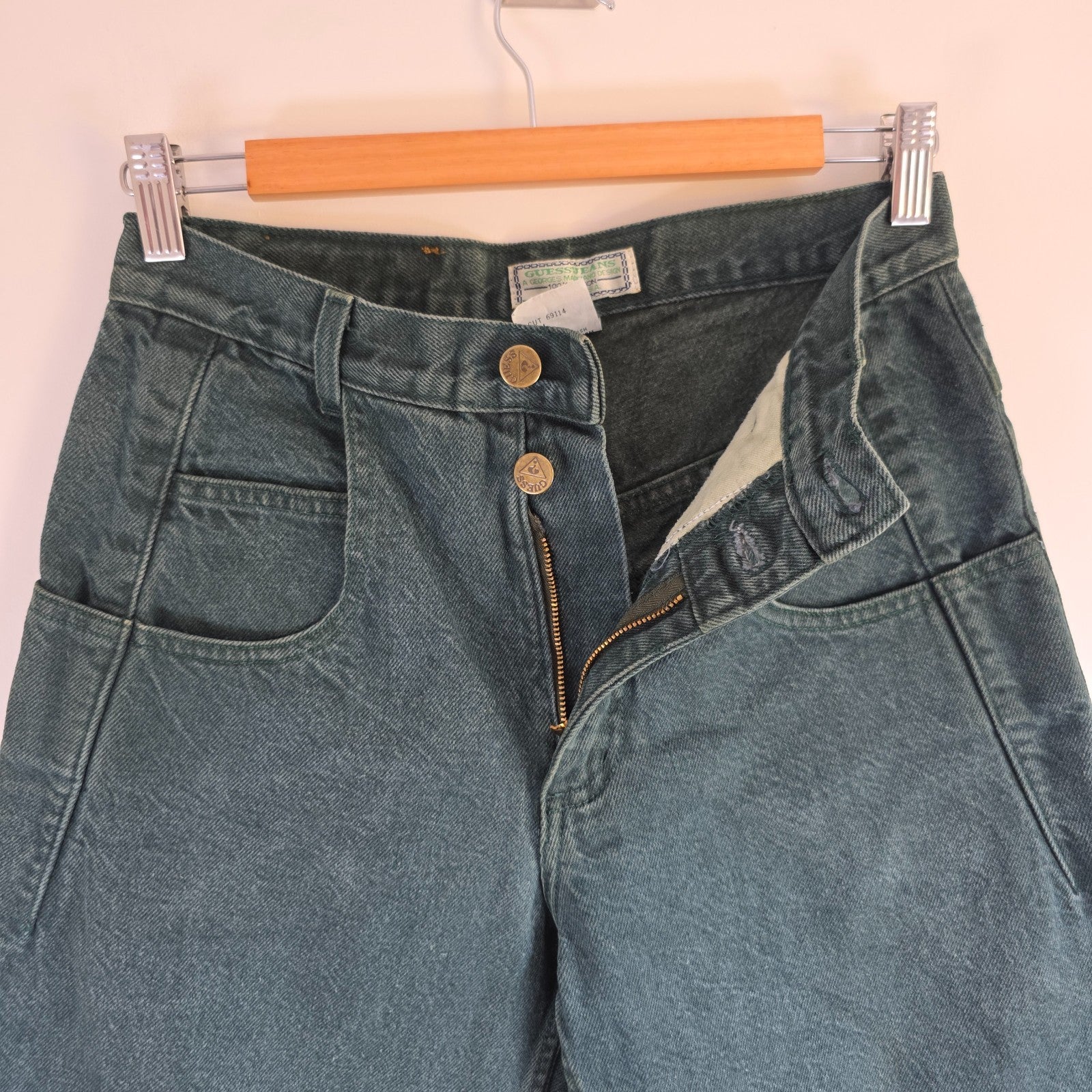 Levi's 501 white jeans distressed with natural wear, made in USA, classic fit.