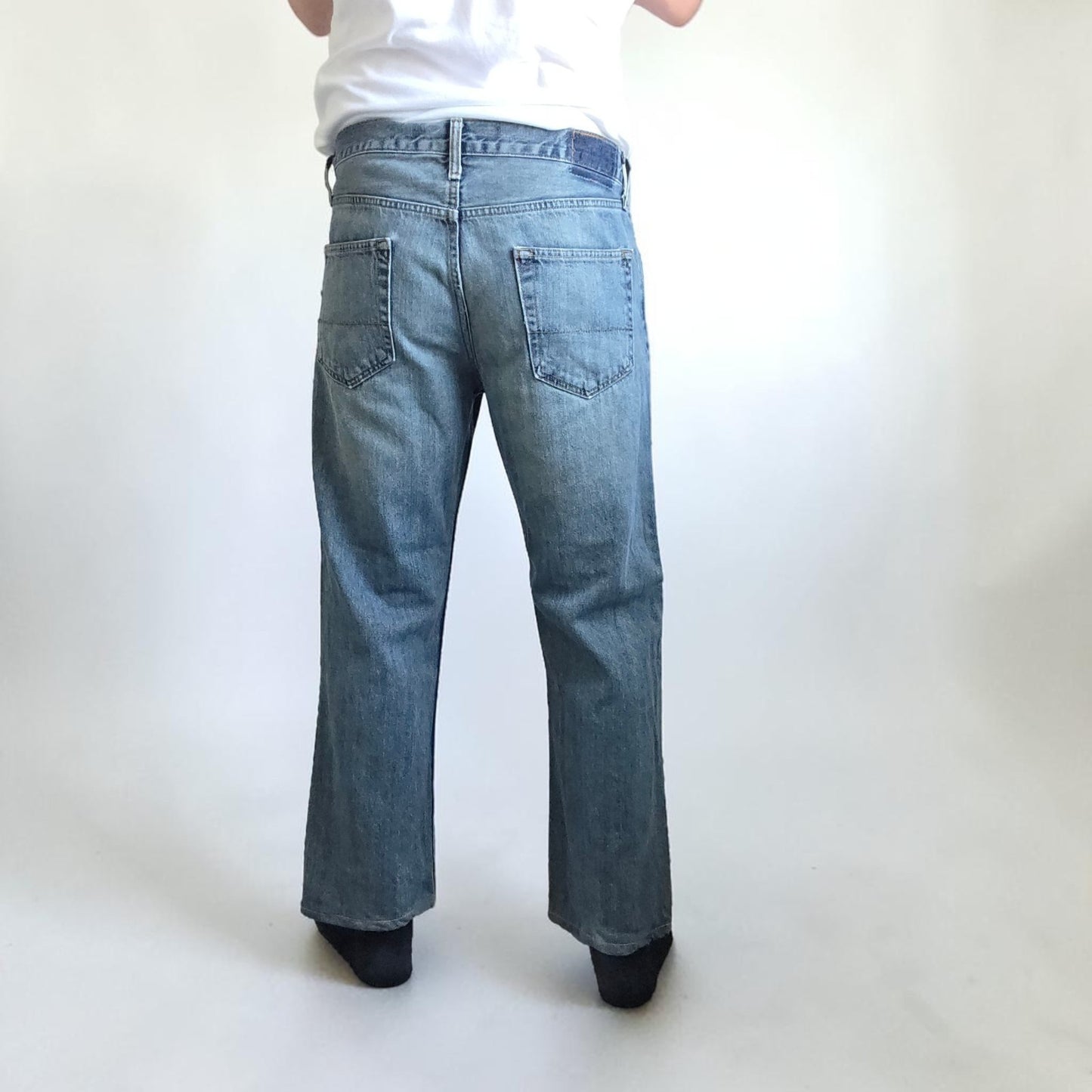 Levi's blue straight leg jeans, cotton material, missing back waist patch, casual style.