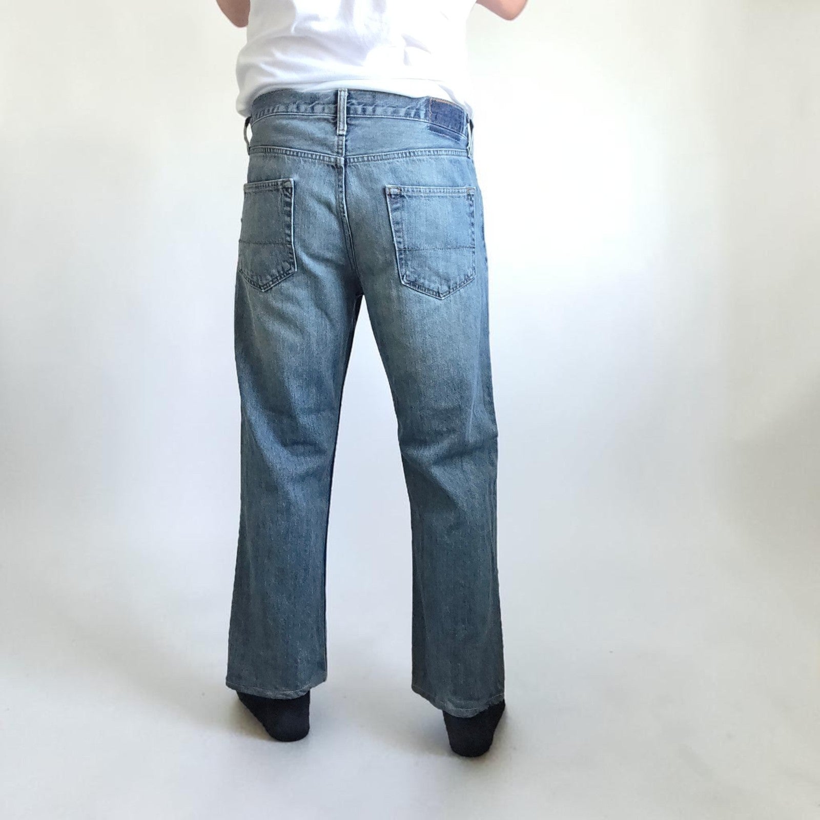 Levi's blue straight leg jeans, cotton material, missing back waist patch, casual style.