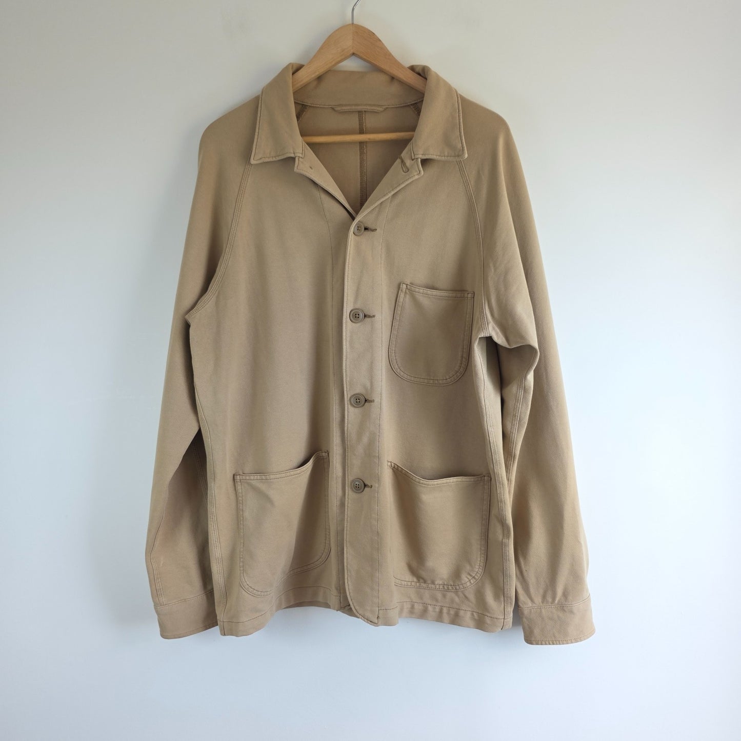 Uniqlo beige chore jacket cotton blend with stretch, classic workwear design.