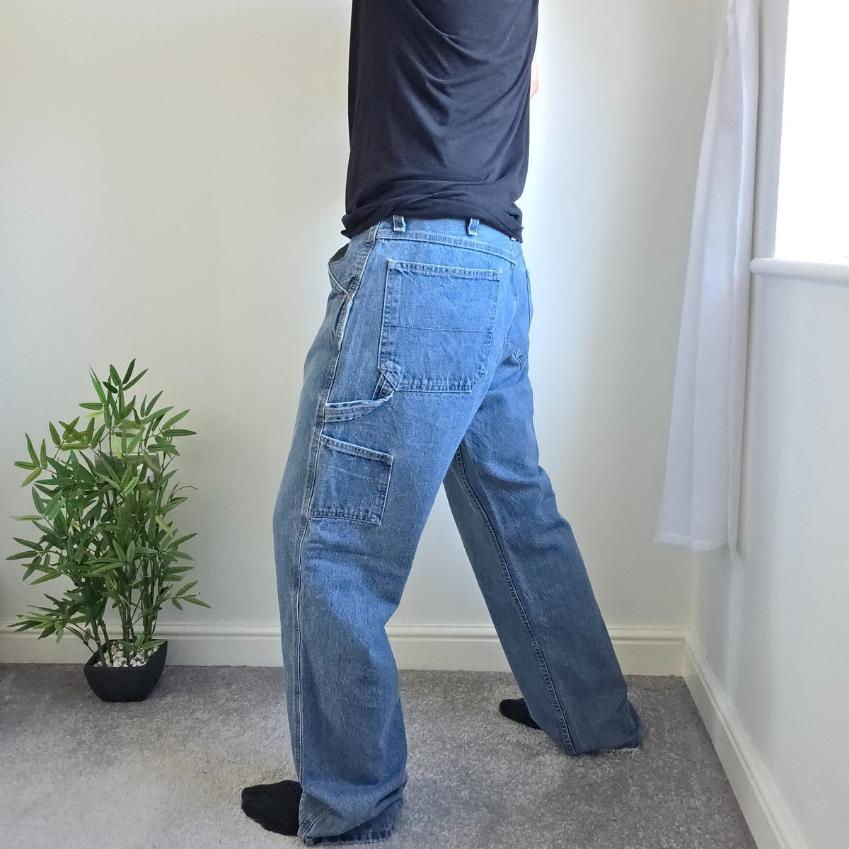 Faded Glory blue carpenter jeans with hammer loop and utility pockets, 100% cotton.