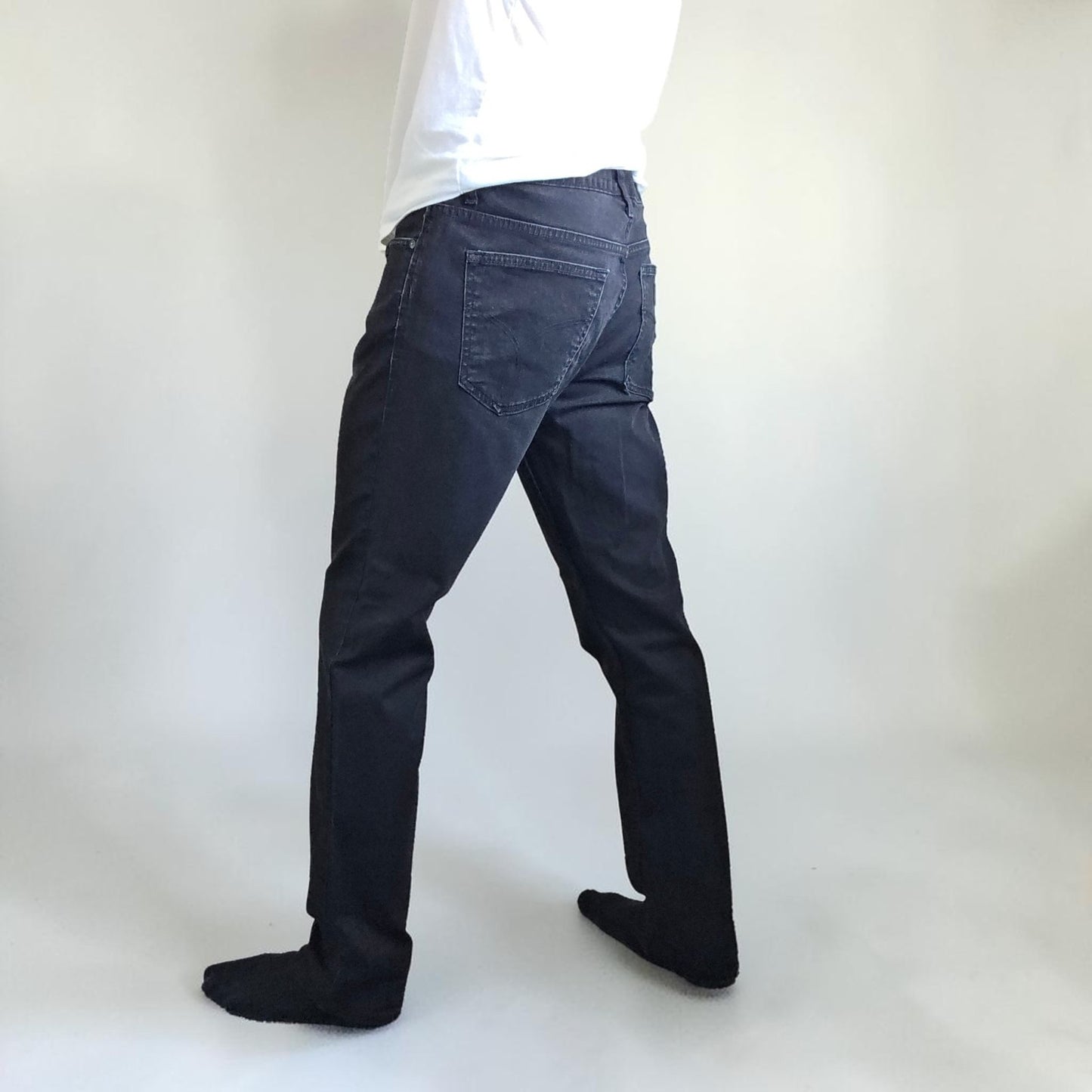 Calvin Klein black straight jeans with logo patch, stretch cotton blend, slim fit design.