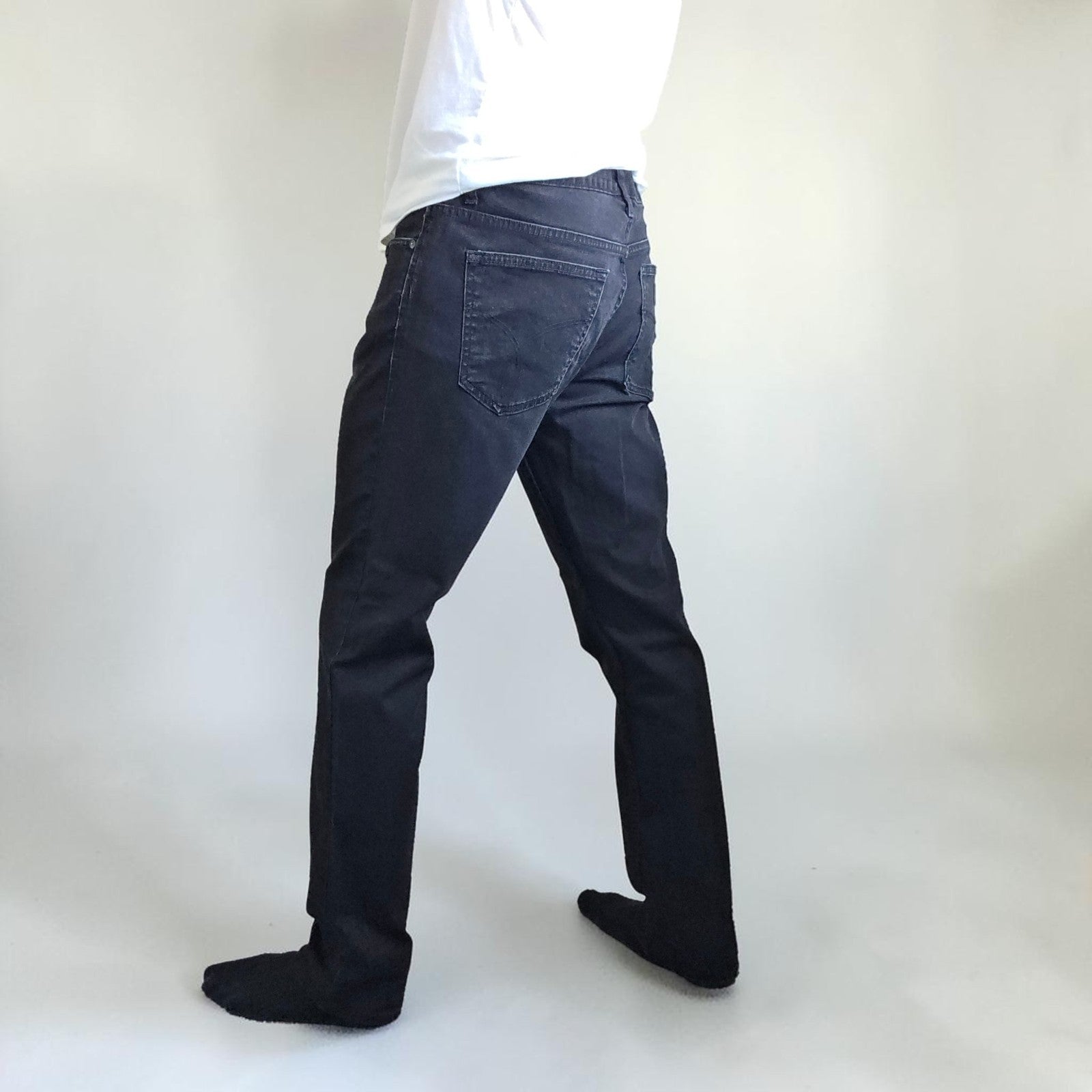 Calvin Klein black straight jeans with logo patch, stretch cotton blend, slim fit design.